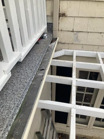 Residential Roofing Installation, Dec-tek walk-out porch roof, siding on garage by Absolute Roofing and Construction
