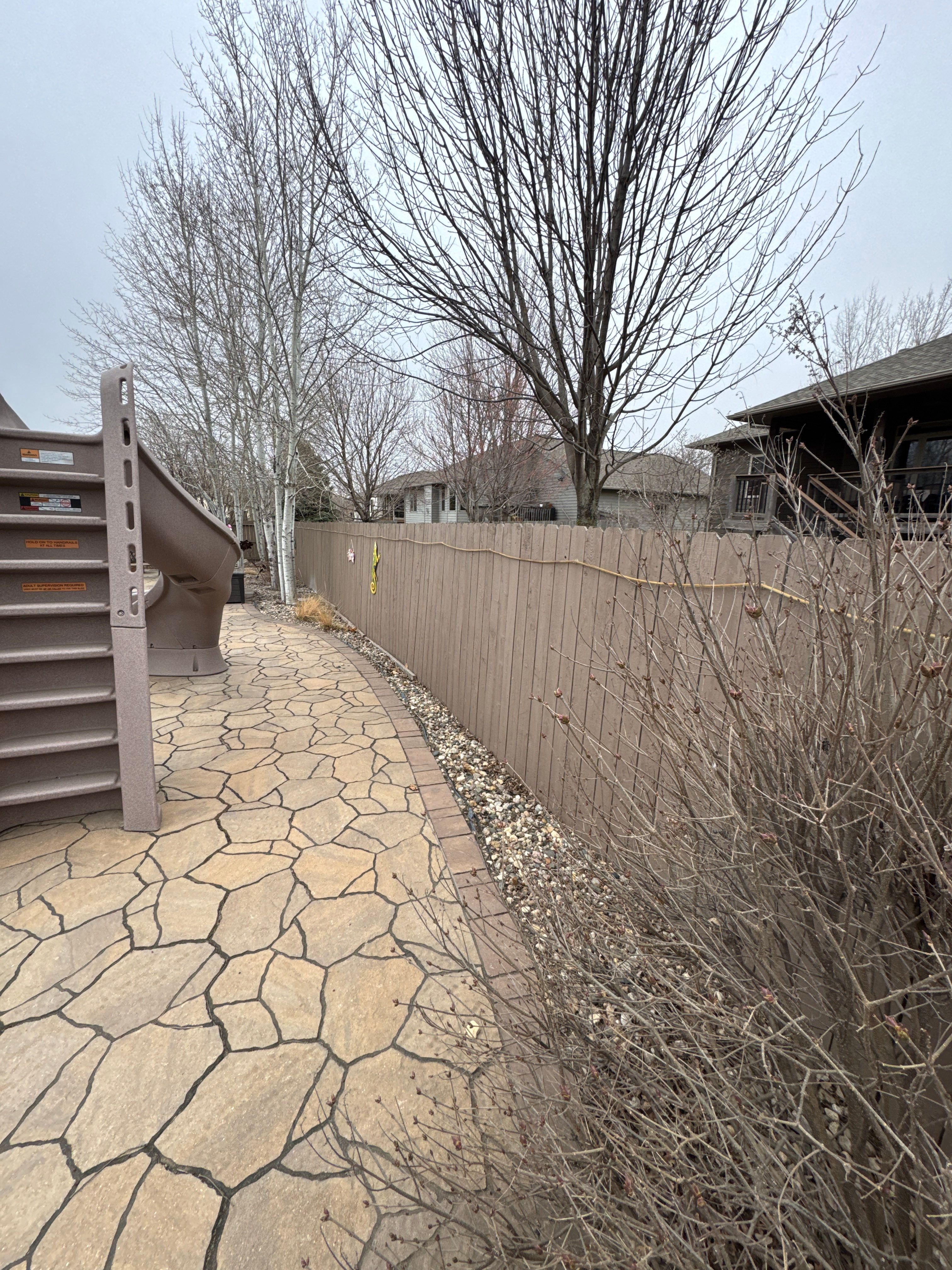 Sioux Falls Residential Exterior Update and Flagstone Pool Deck by Select Painting, Coatings & Garage Cabinets