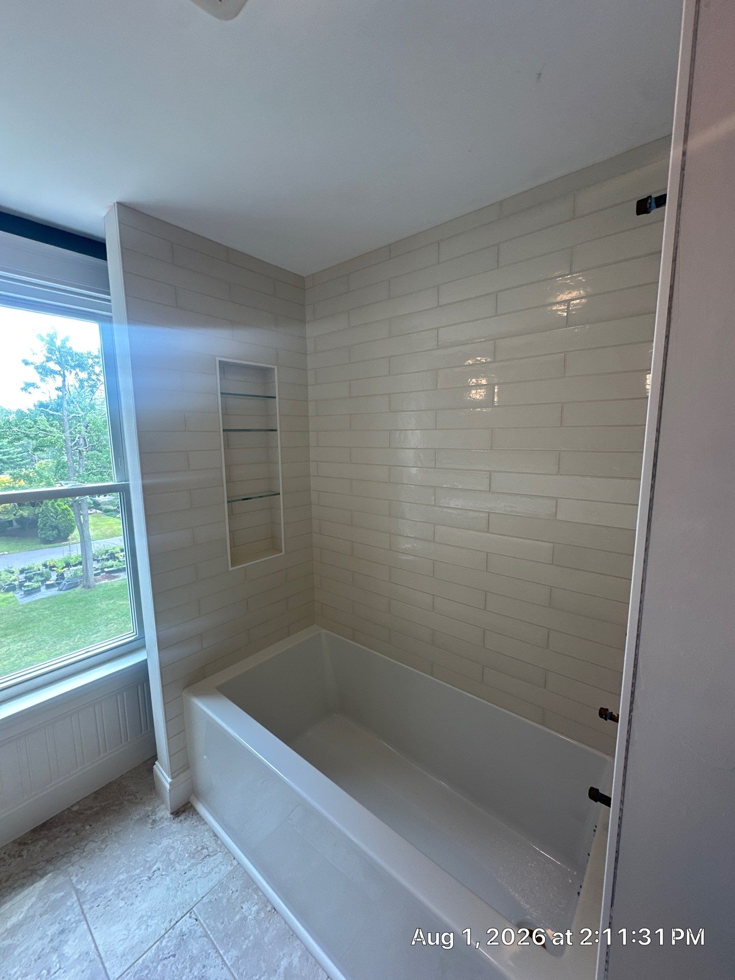 Manchester Bathroom Remodel with Subway Tile Surround and Granite Vanity by Renovatic LLC