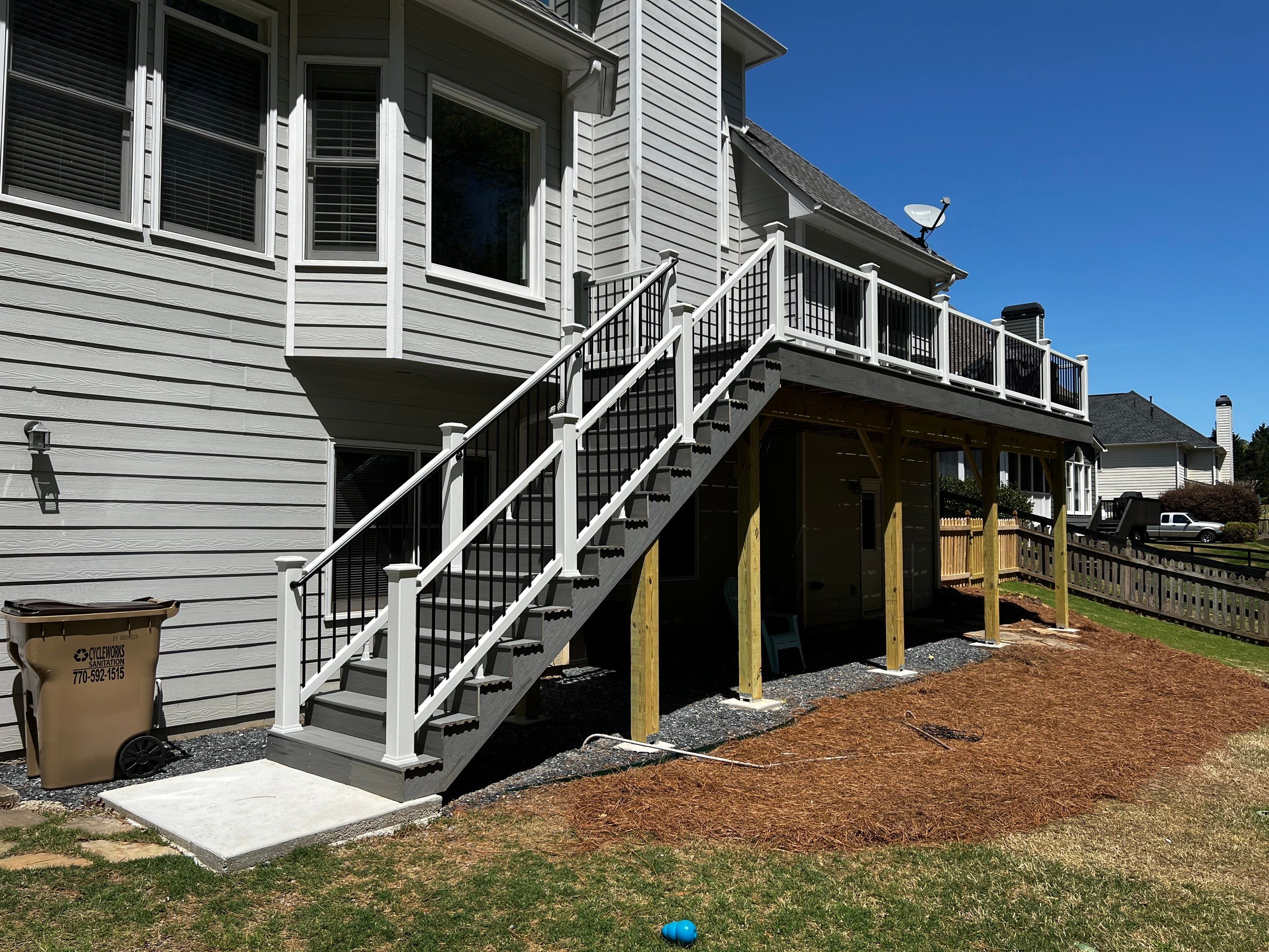 Elevated Grey Composite Deck Installation in Woodstock by Swift Home Renovations 