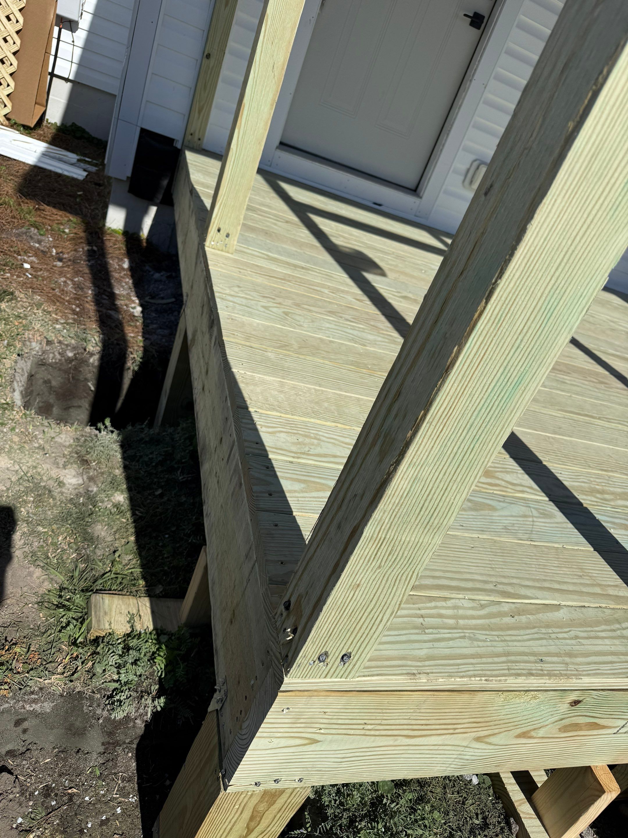 Custom Screened Porch and Deck Addition in Sea Level by The Remodeling Company
