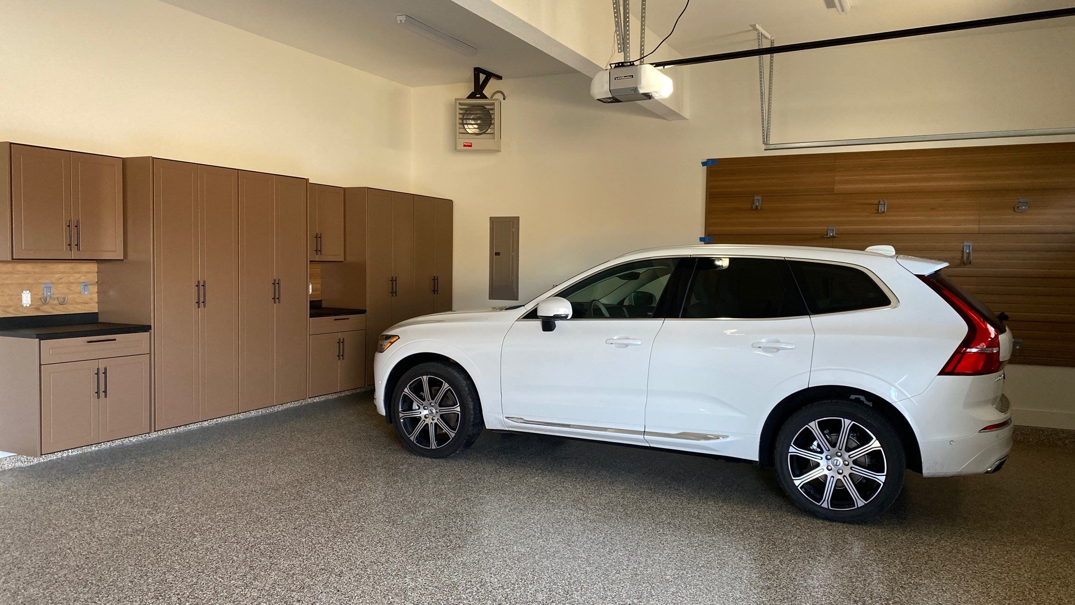 Kenny & Debbie transformed their garage with a Banner Garage Floor and cabinets by Banner Garage