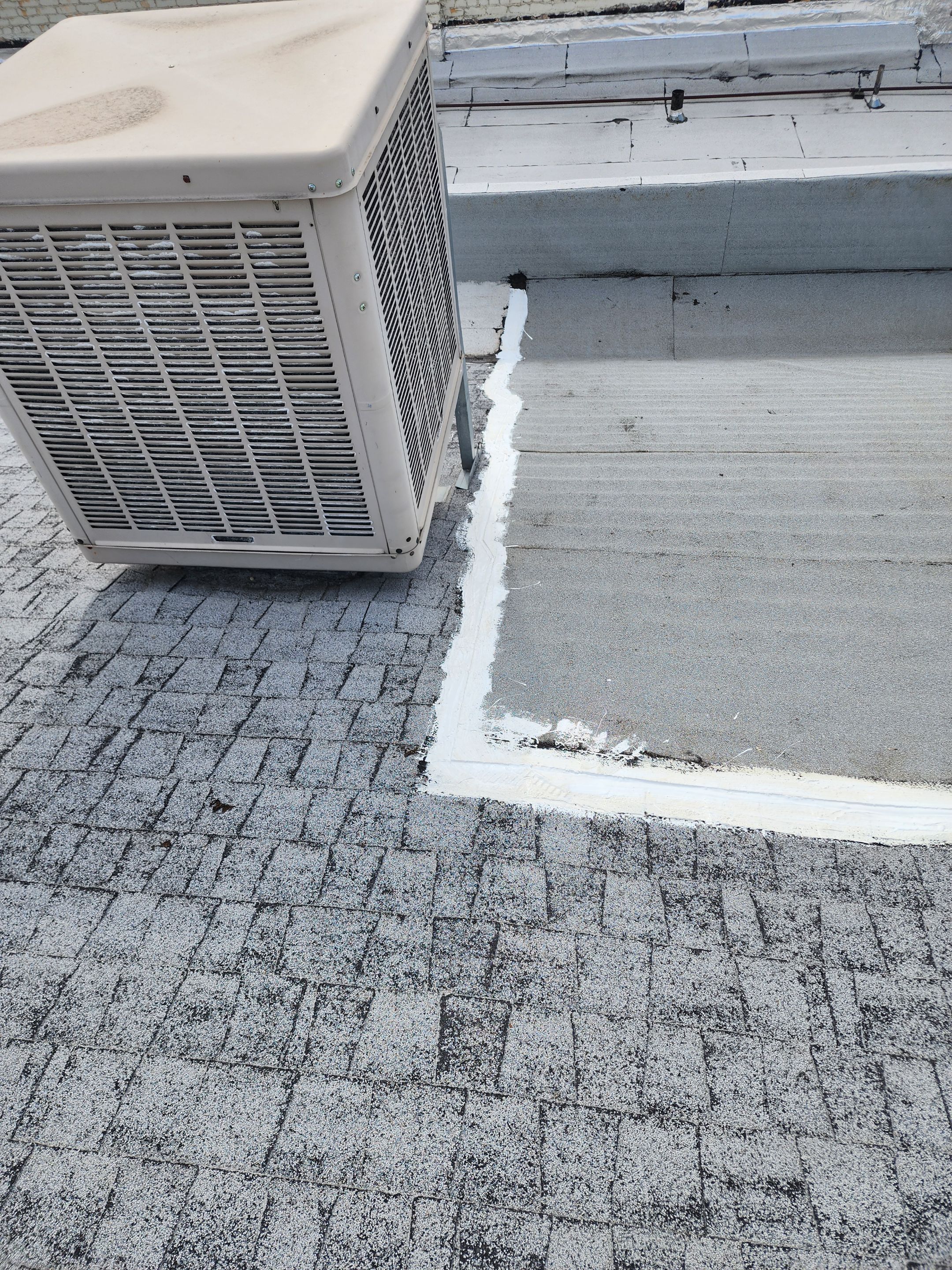 Foam and coatings on commercial roof by Straight Edge Roofing Inc