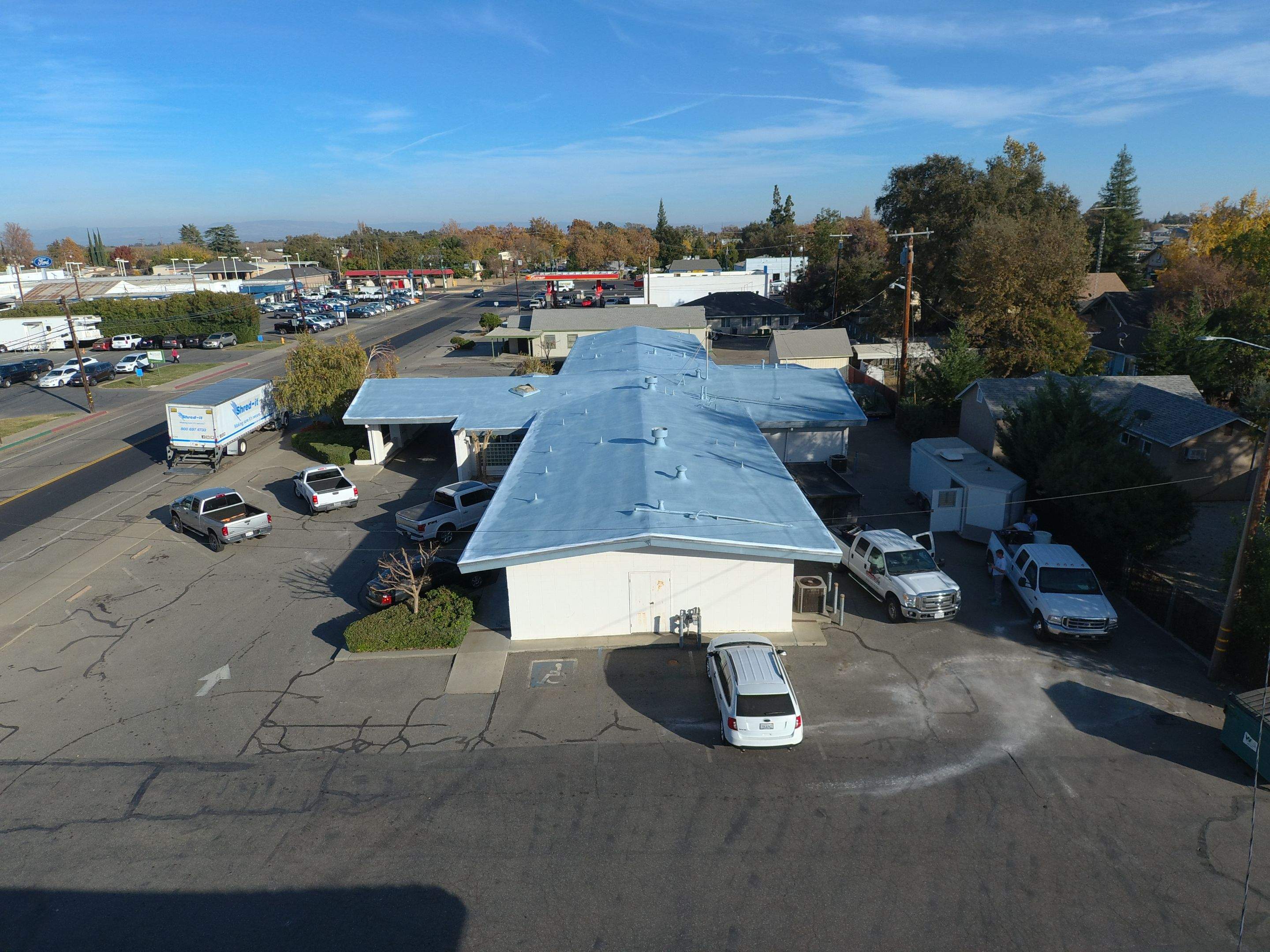 Spray foam and coatings using Conklin Benchmark/PUMA XL coatings and spray foam by Straight Edge Roofing Inc