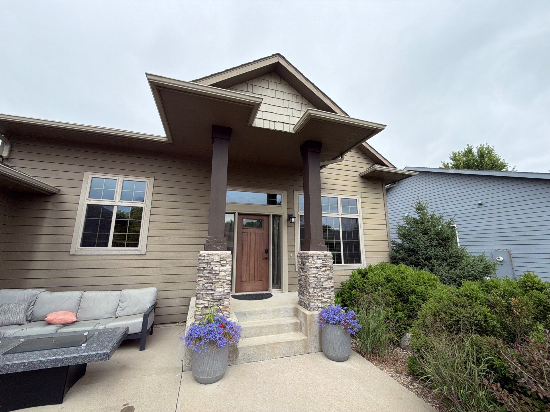 Full Exterior Siding Repaint for Sioux Falls Home and Garage by Select Painting, Coatings & Garage Cabinets