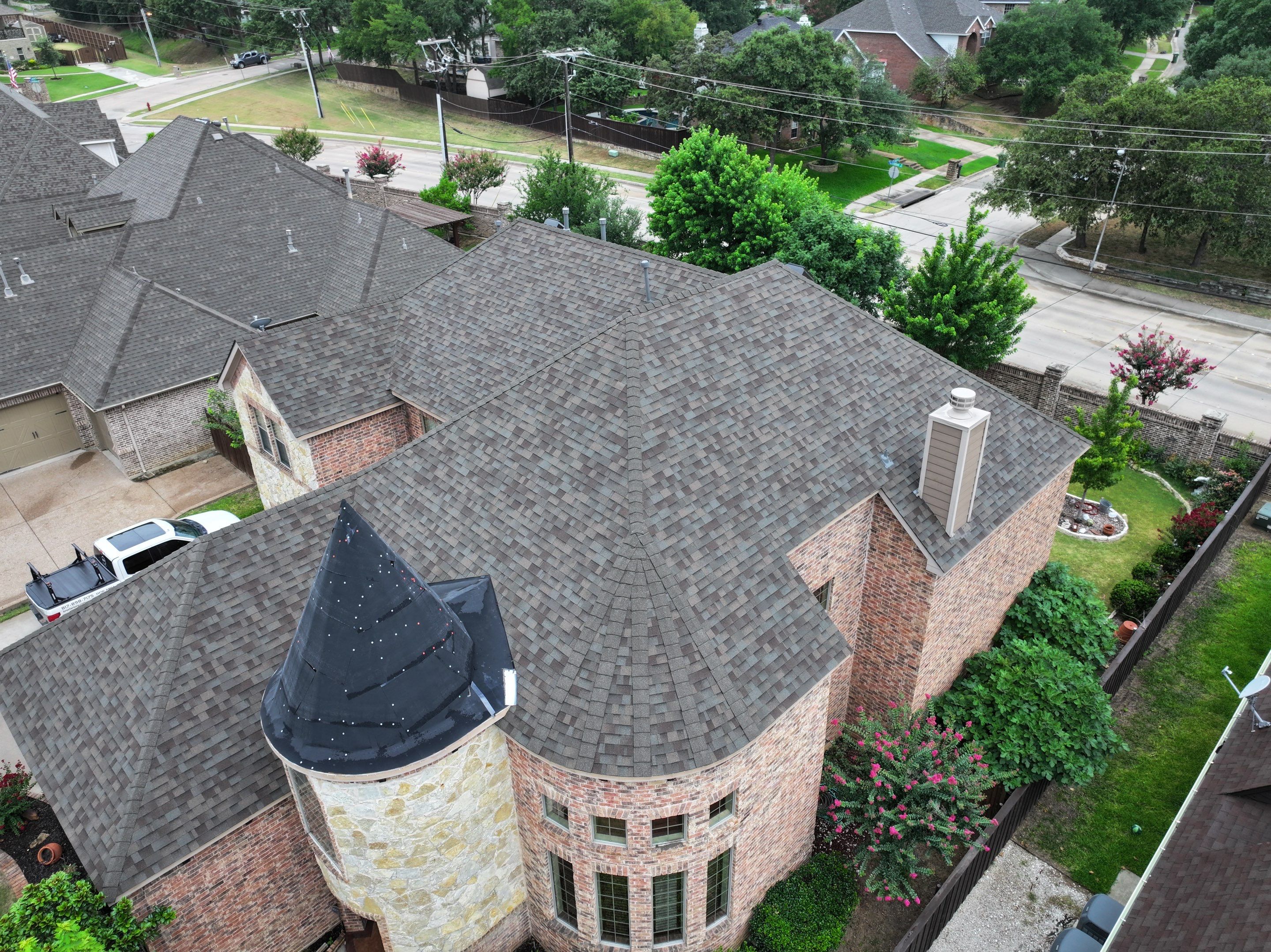Installing Custom copper turret and Malarkey Vista Class 4 shingles Hail Damage Upgrade by Becker Roofing and Exteriors