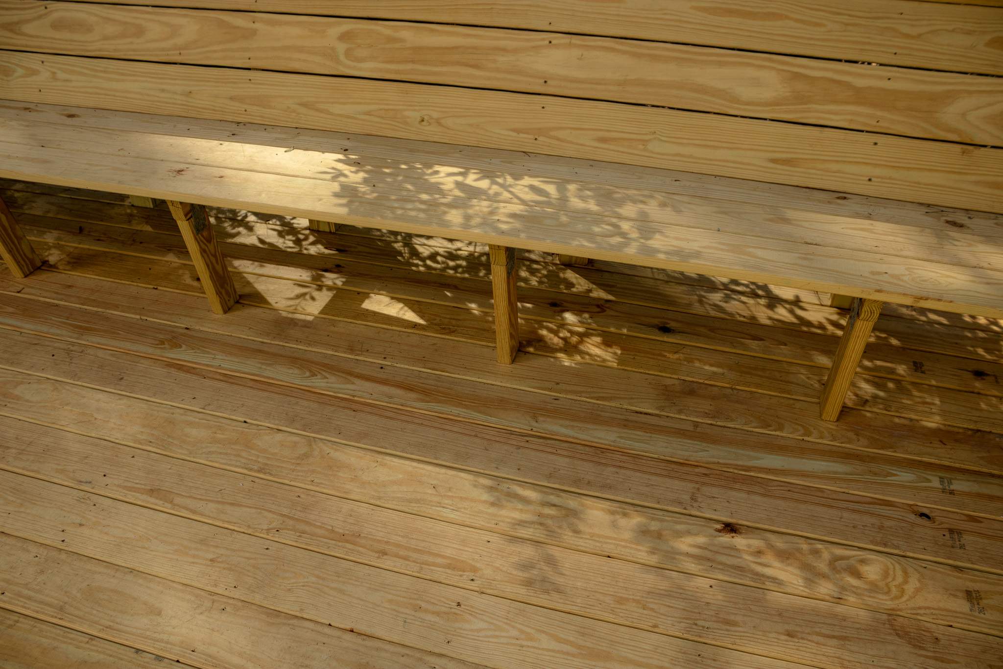Deck Resurface with Wood Bench Install Using Pressure Treated Pine by Nelson Exteriors 