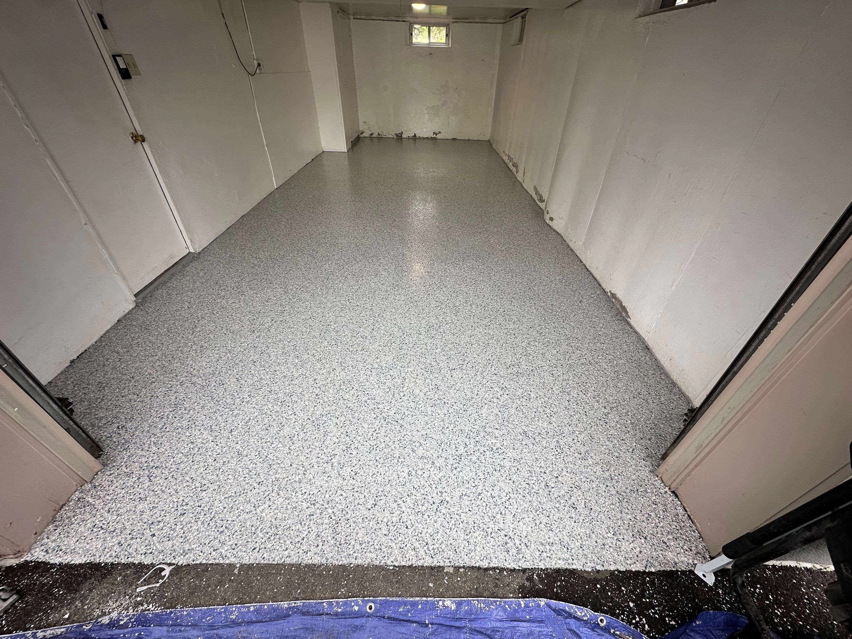 Garage Concrete Floor Coating Transformation by DiGiorgi Roofing and Siding Inc