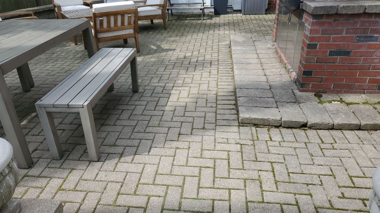 Brick patio repair, clean sand and seal by Northern Power Washing LLC.