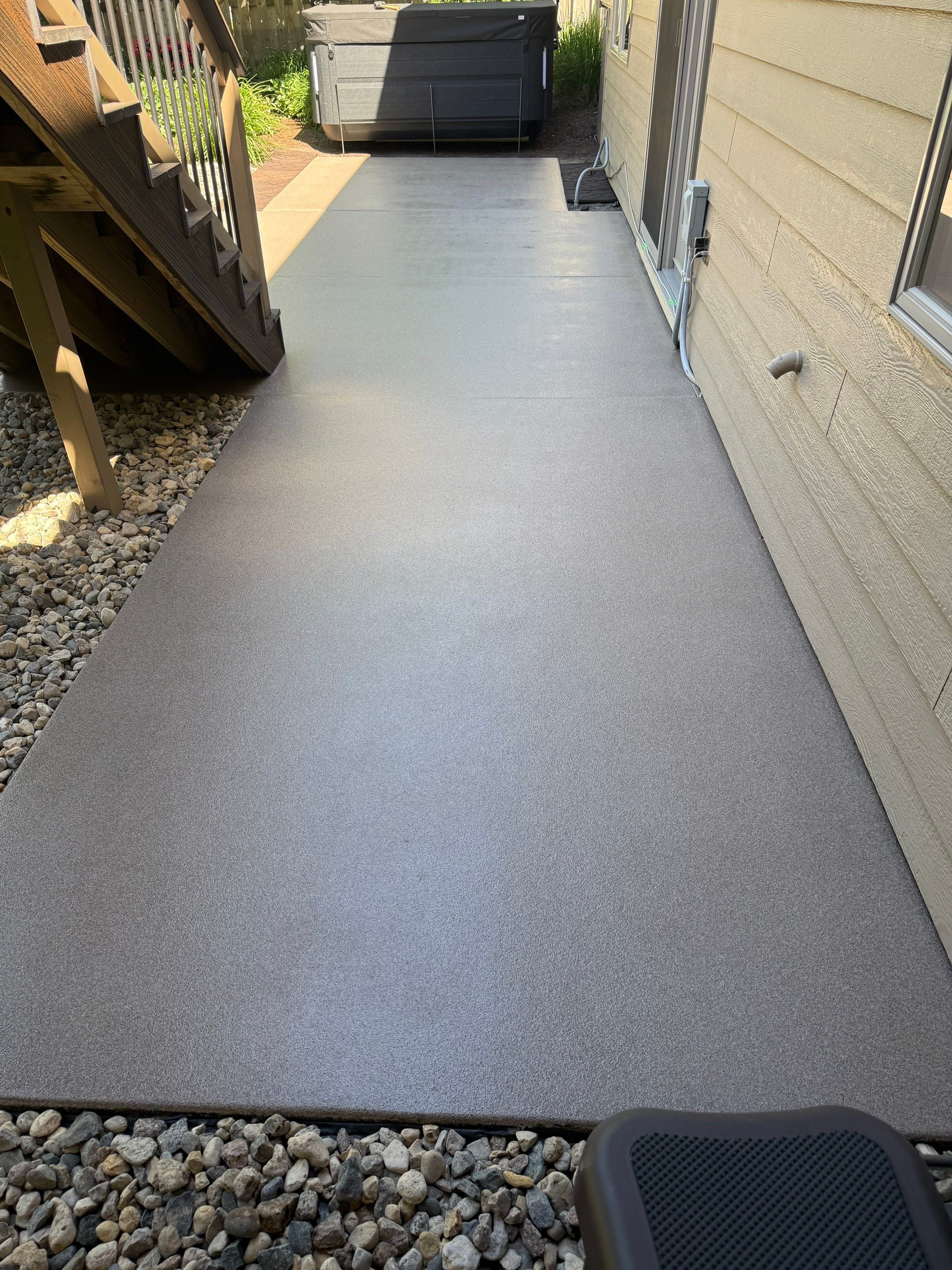 Textured Concrete Coating and Paver Patio Refresh in Sioux Falls by Select Painting, Coatings & Garage Cabinets