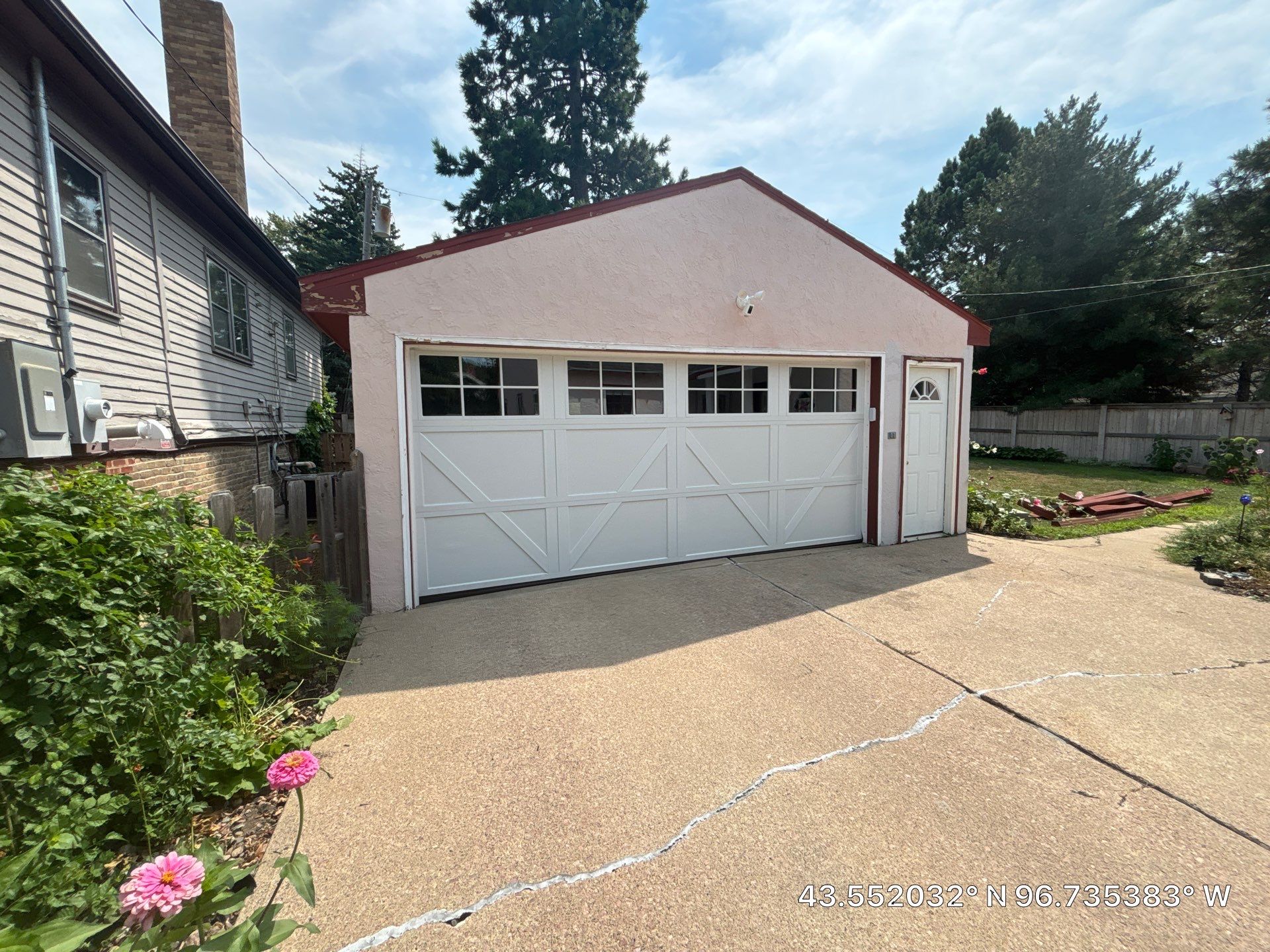 Exterior Stucco Painting and Trim Refresh in Sioux Falls by Select Painting, Coatings & Garage Cabinets