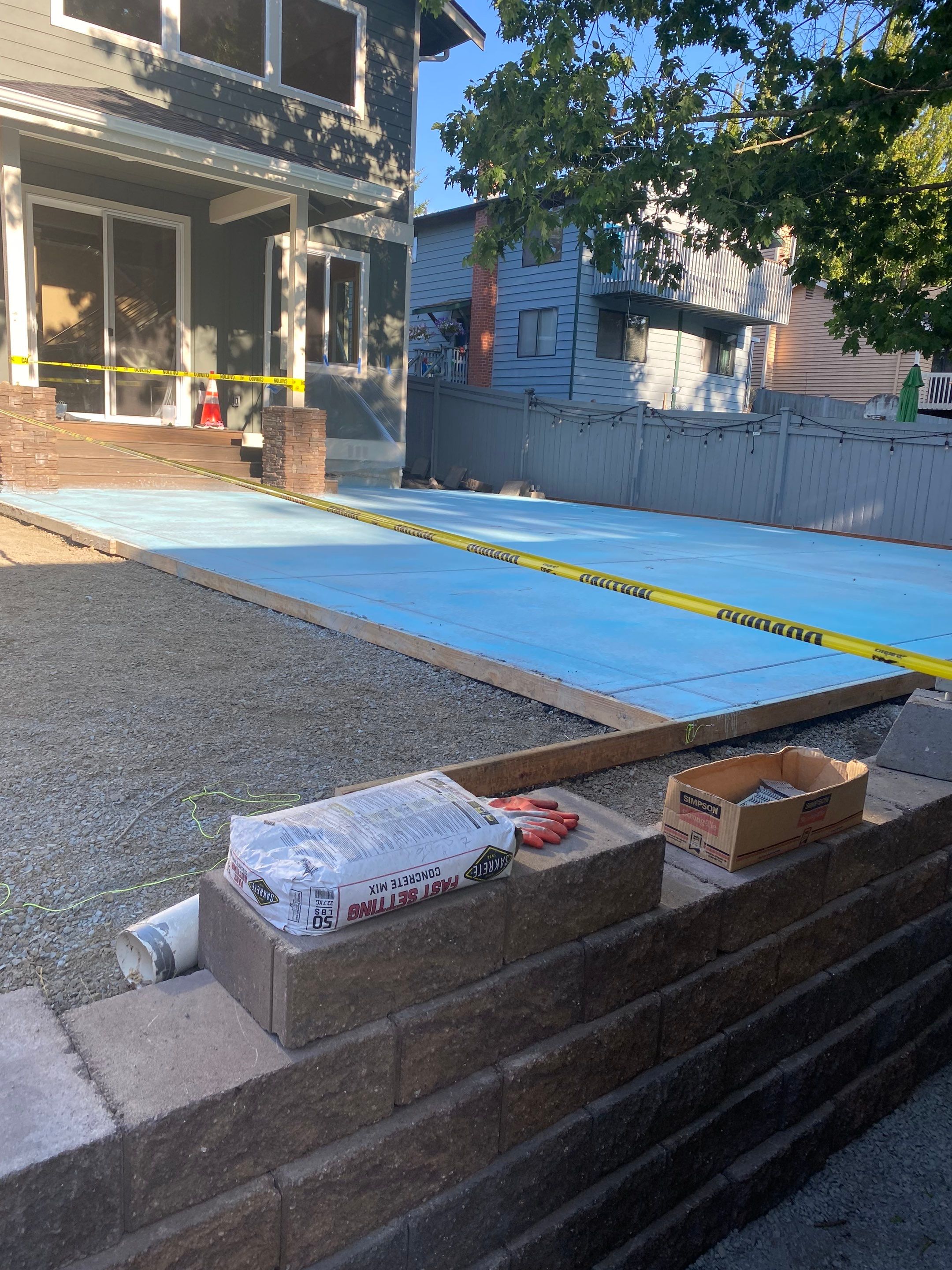 Patio Installation using Concrete, Retaining walls, and Turf install by Jireh Asphalt & Concrete Inc 