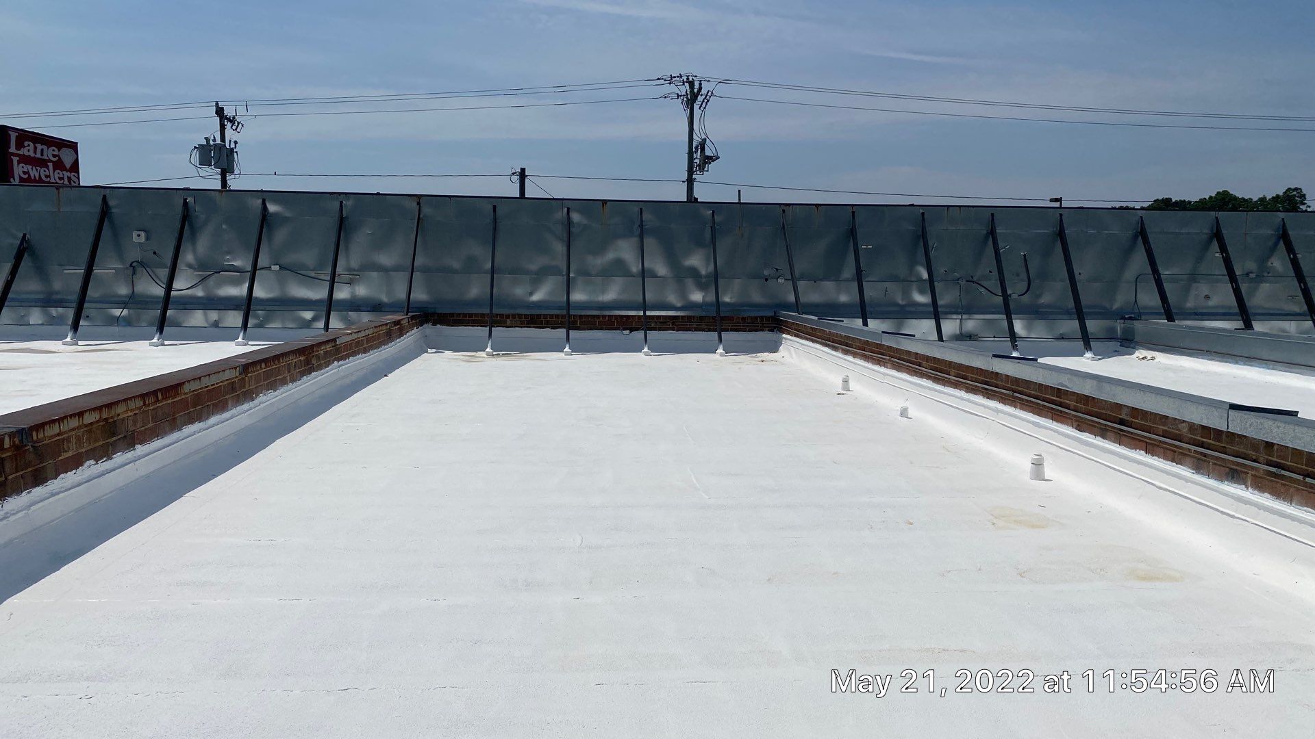 Commercial Roof Coating using Fiberseal basecoat and Silicon Topcoat by Just In Time Roofing and Restoration
