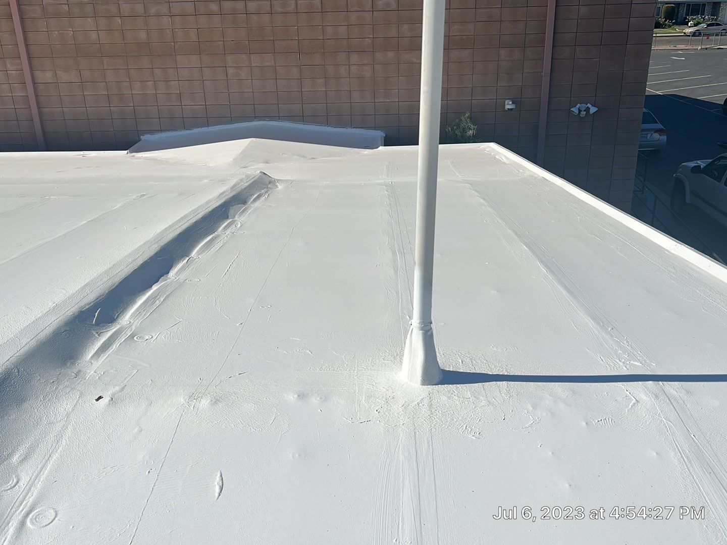 MR Roofing system using Benchmark/PUMA XL coatings over TPO single-ply roofing by Straight Edge Roofing Inc