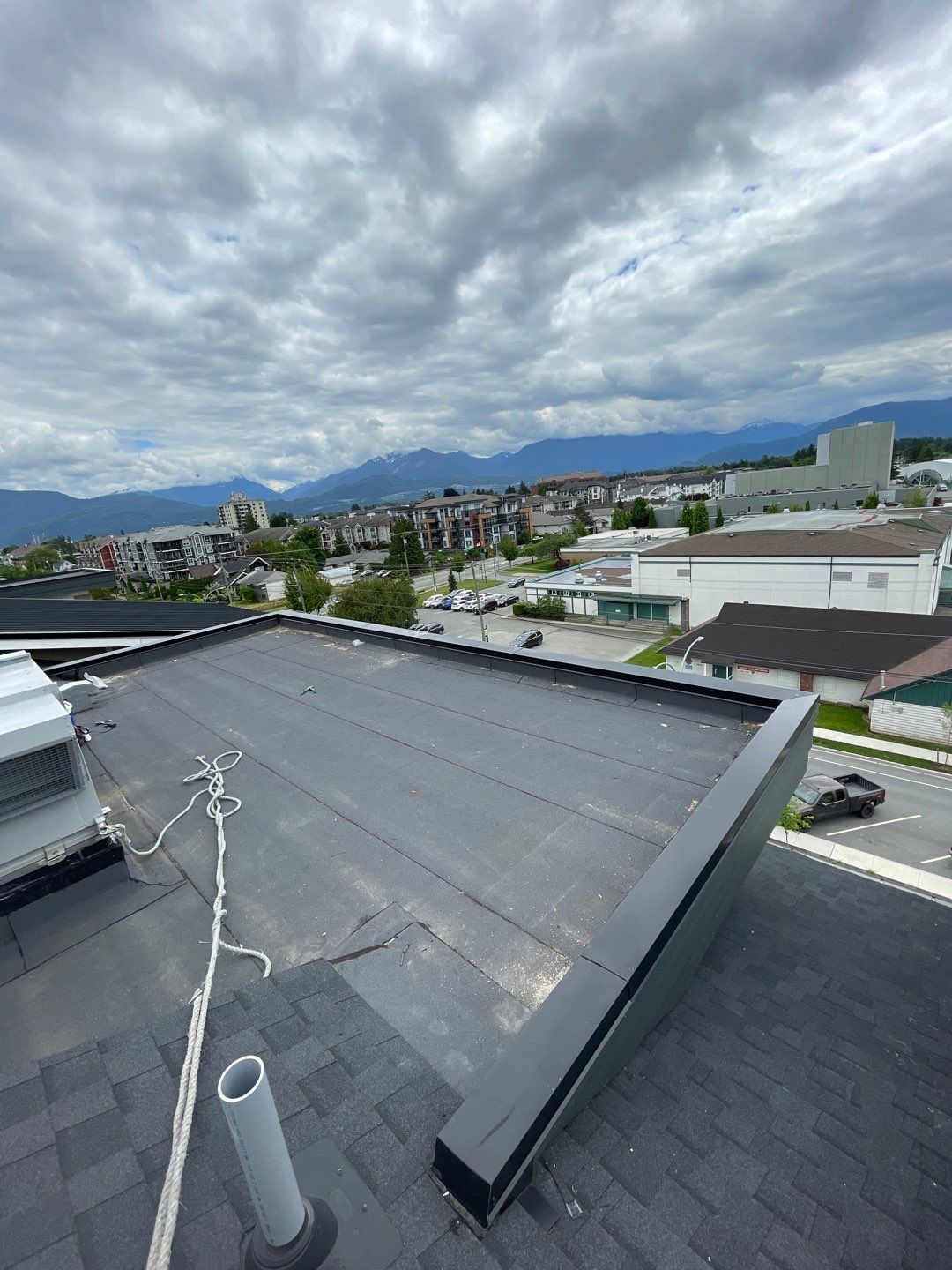 Large apartment with sbs, shingles and prolok metal  by Top Notch Roofing Inc