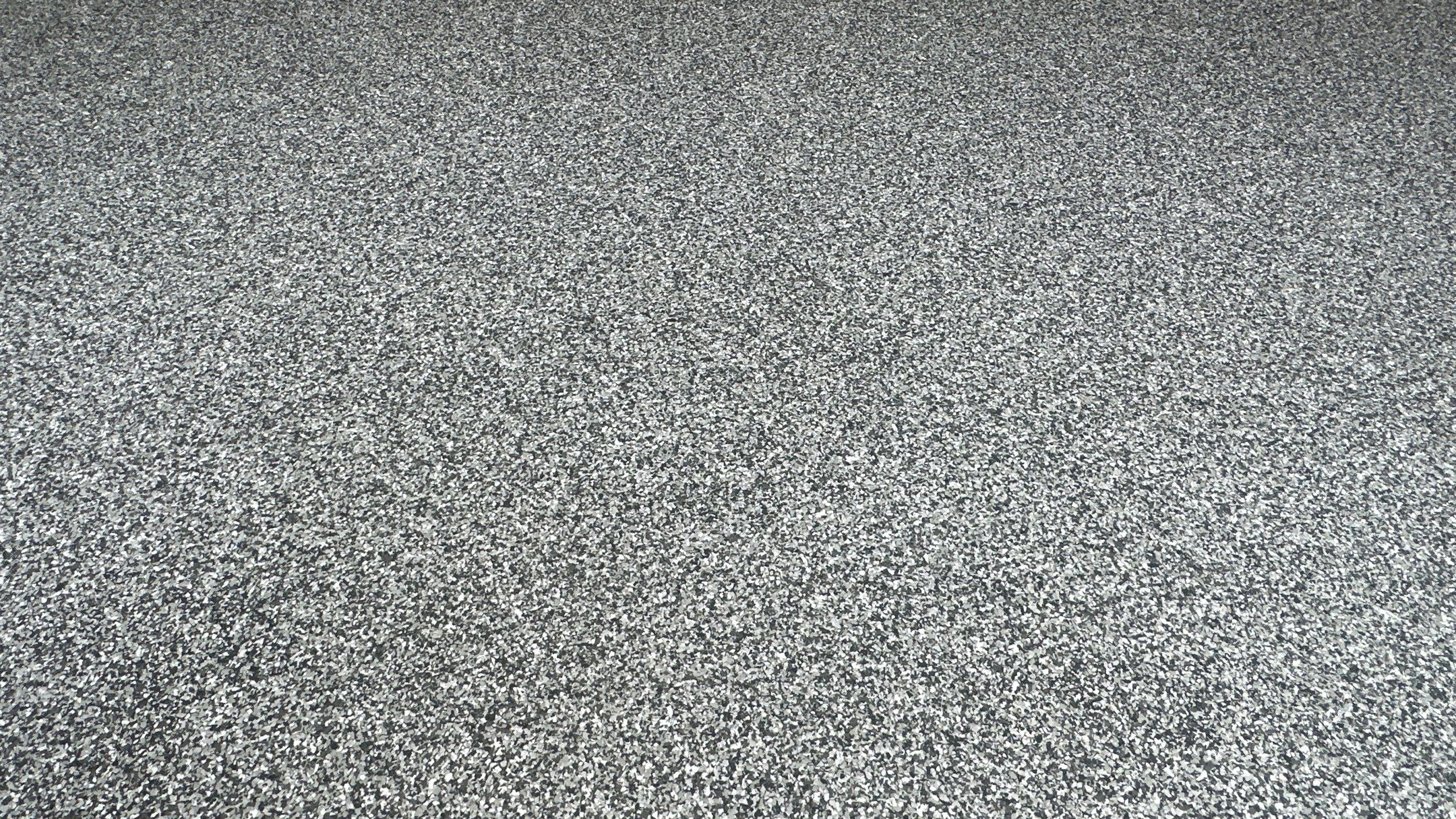 Check out how beautiful a brand new stonehenge flake floor looks by Banner Garage