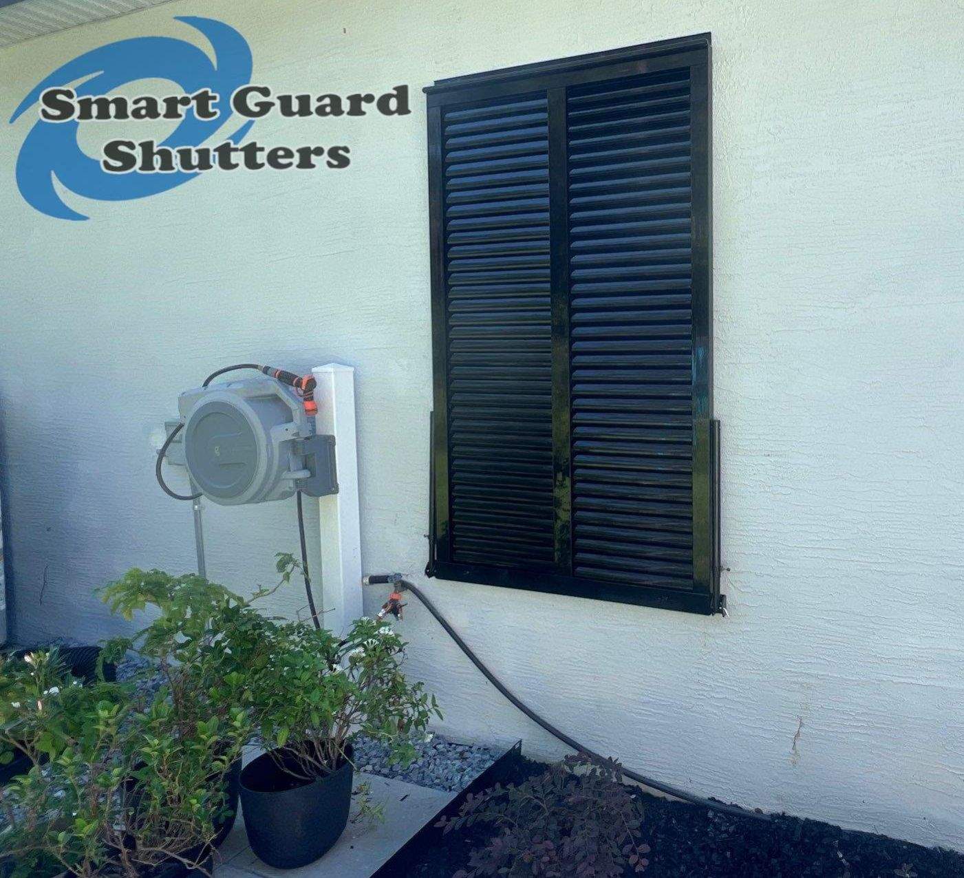 Impact Bahama Shutters in Jet Black by Smart Guard Shutters