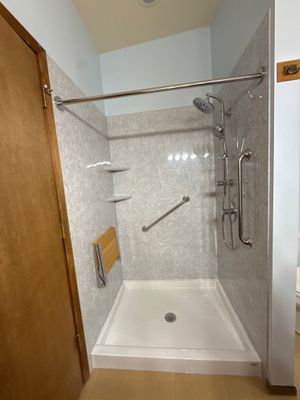 Walk-In Shower Replacement with Marbled Panels in Indian River