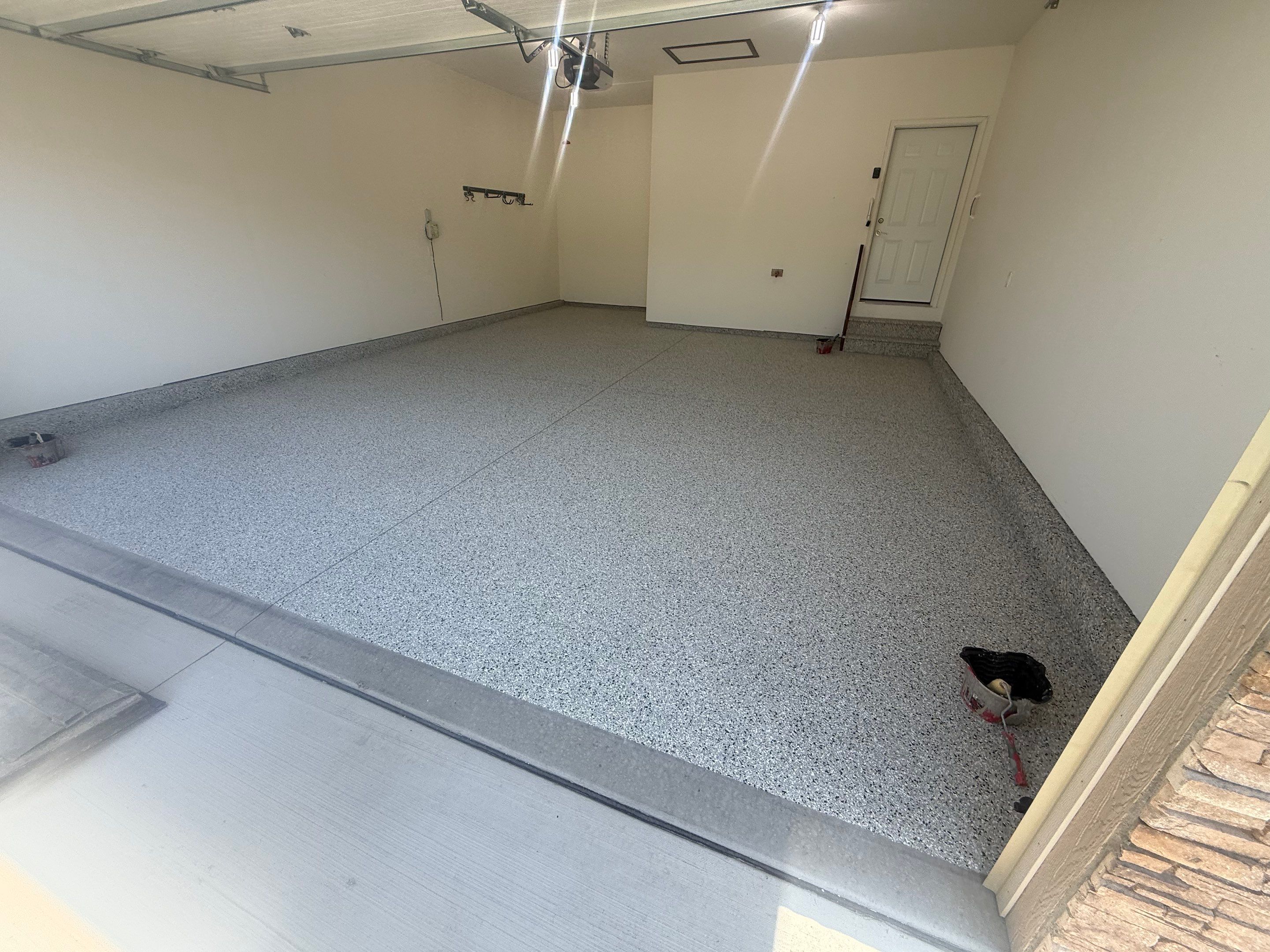 Cabin Fever Garage Floor Coating in Sioux Falls by Select Painting, Coatings & Garage Cabinets