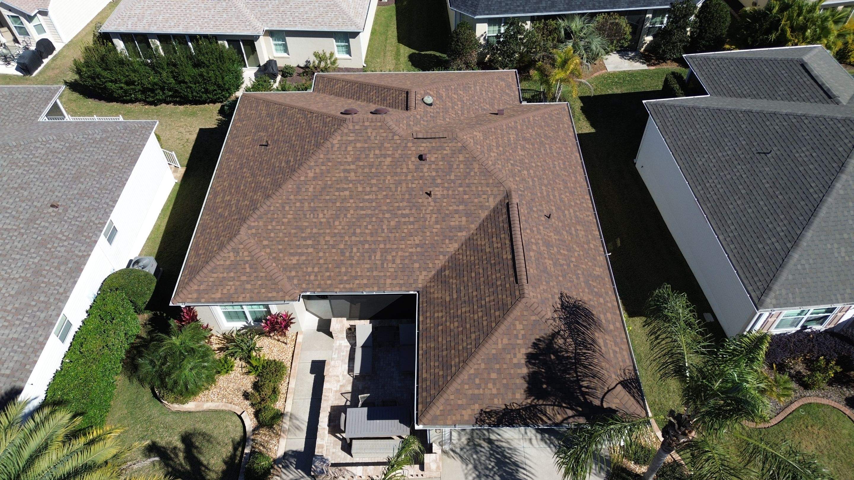 Florida roofers installing shingles by Brehm Roofing