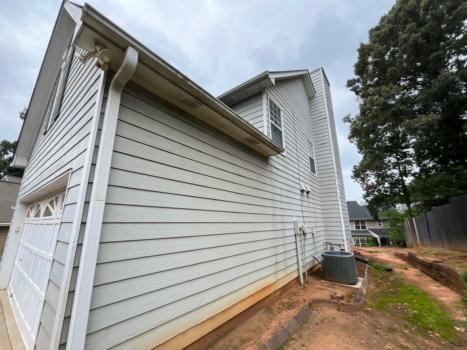 Lawrenceville, GA Full Siding Replacement, Exterior Painting, and Window Installation by Nelson Exteriors 