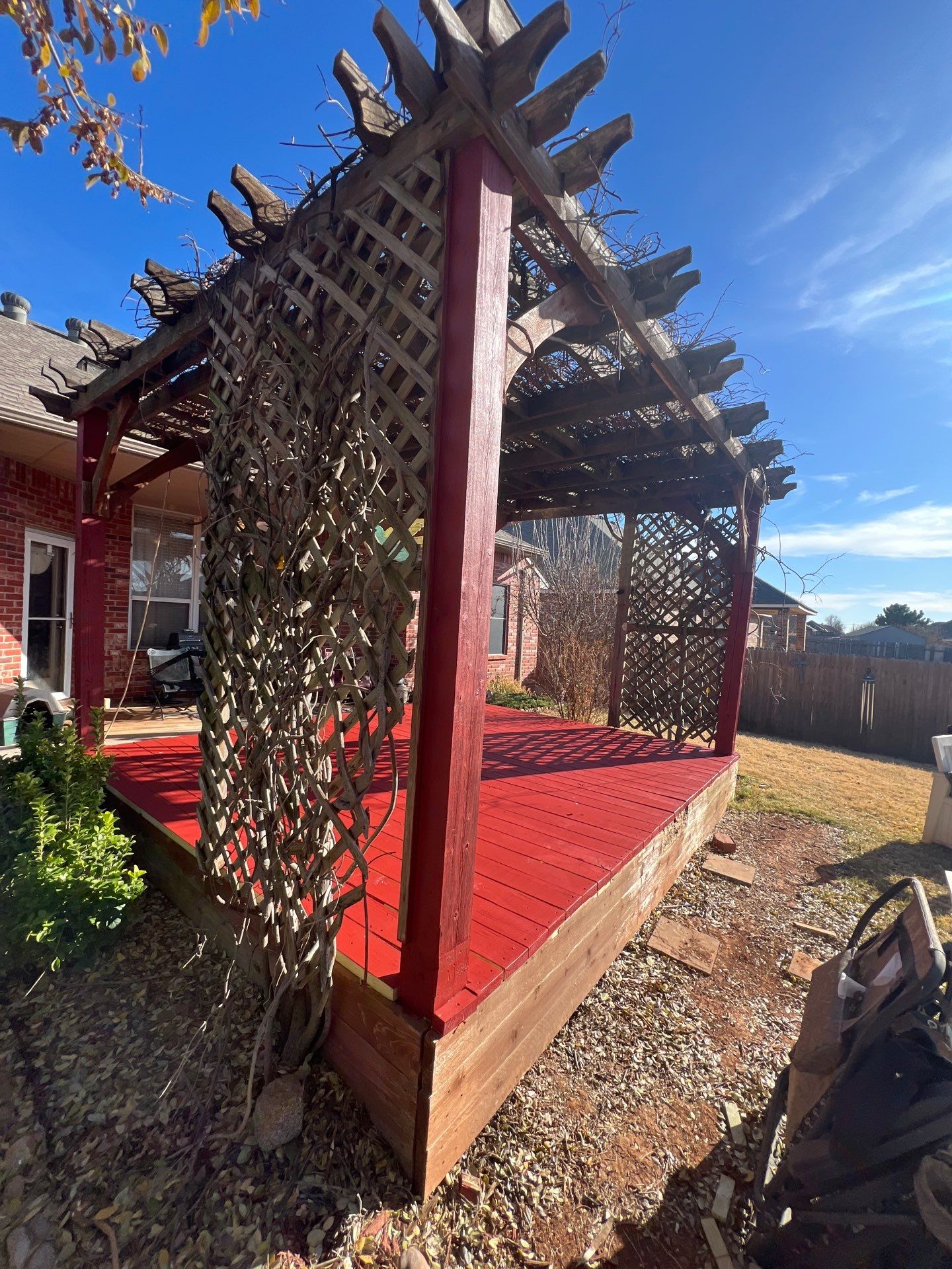 pergola installation and painting in Yukon by McCann's Roofing and Construction