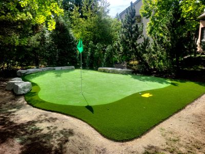 Custom Backyard Putting Green around Landscape Boulders in Hilliard
