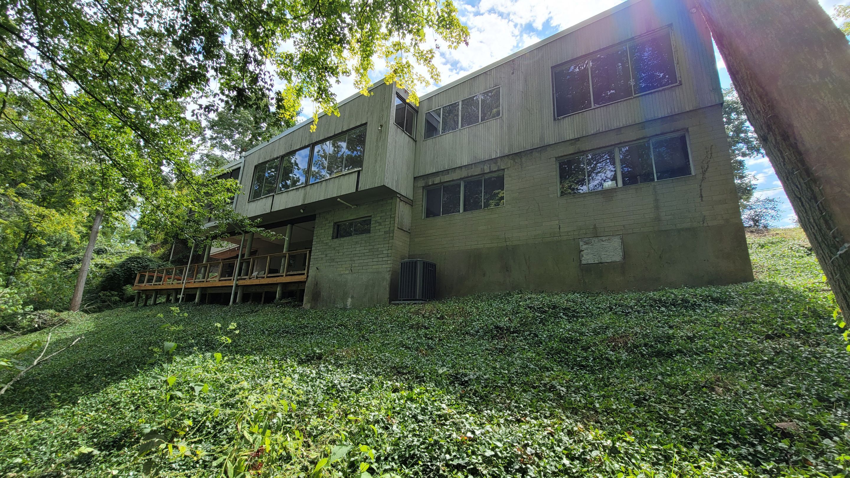 Land Clearing Behind House and Deck by Reisenberg’s Lawn & Landscape, LLC