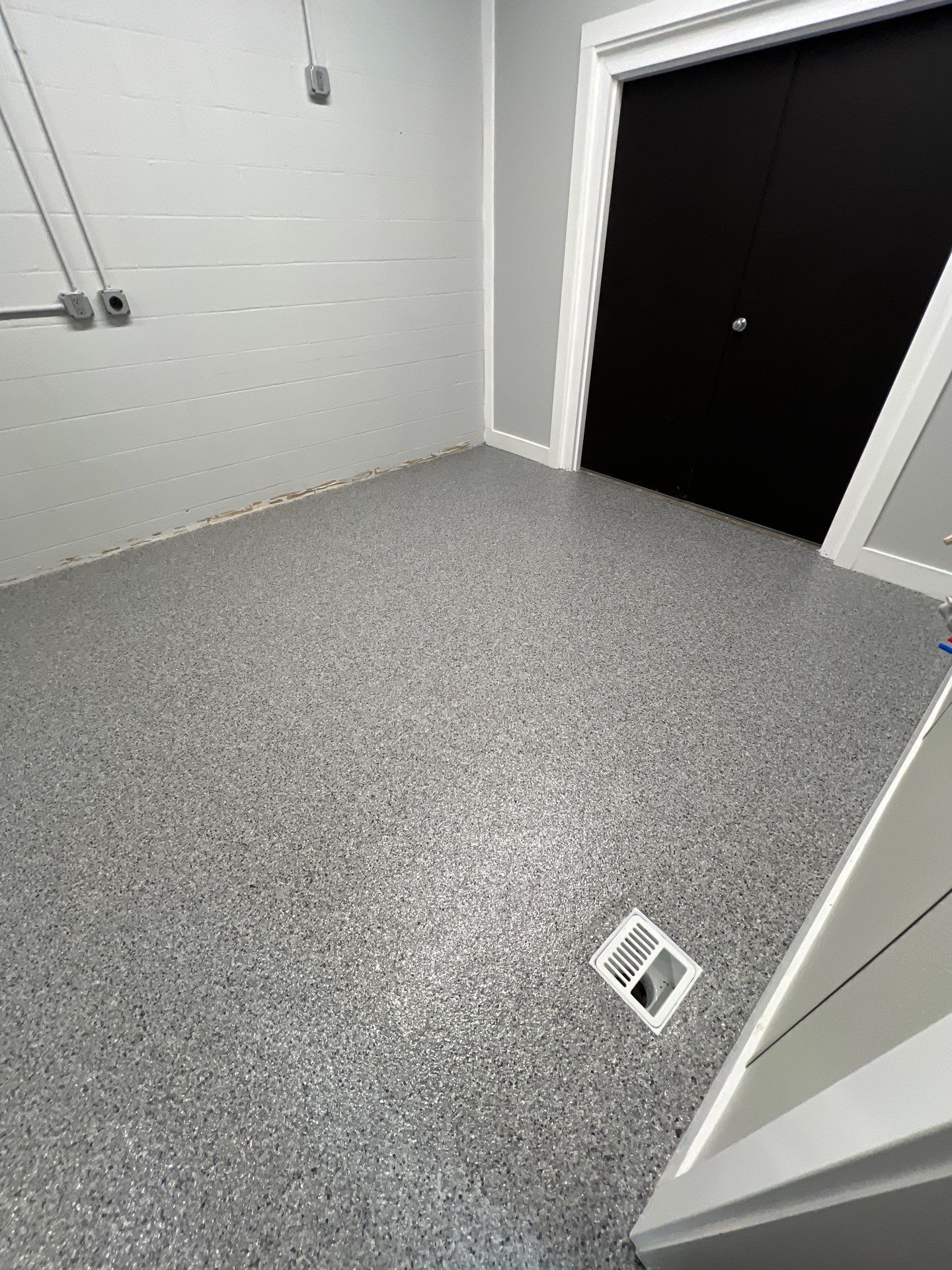 Silverado garage floor coating  by NG Masonry & Construction LLC