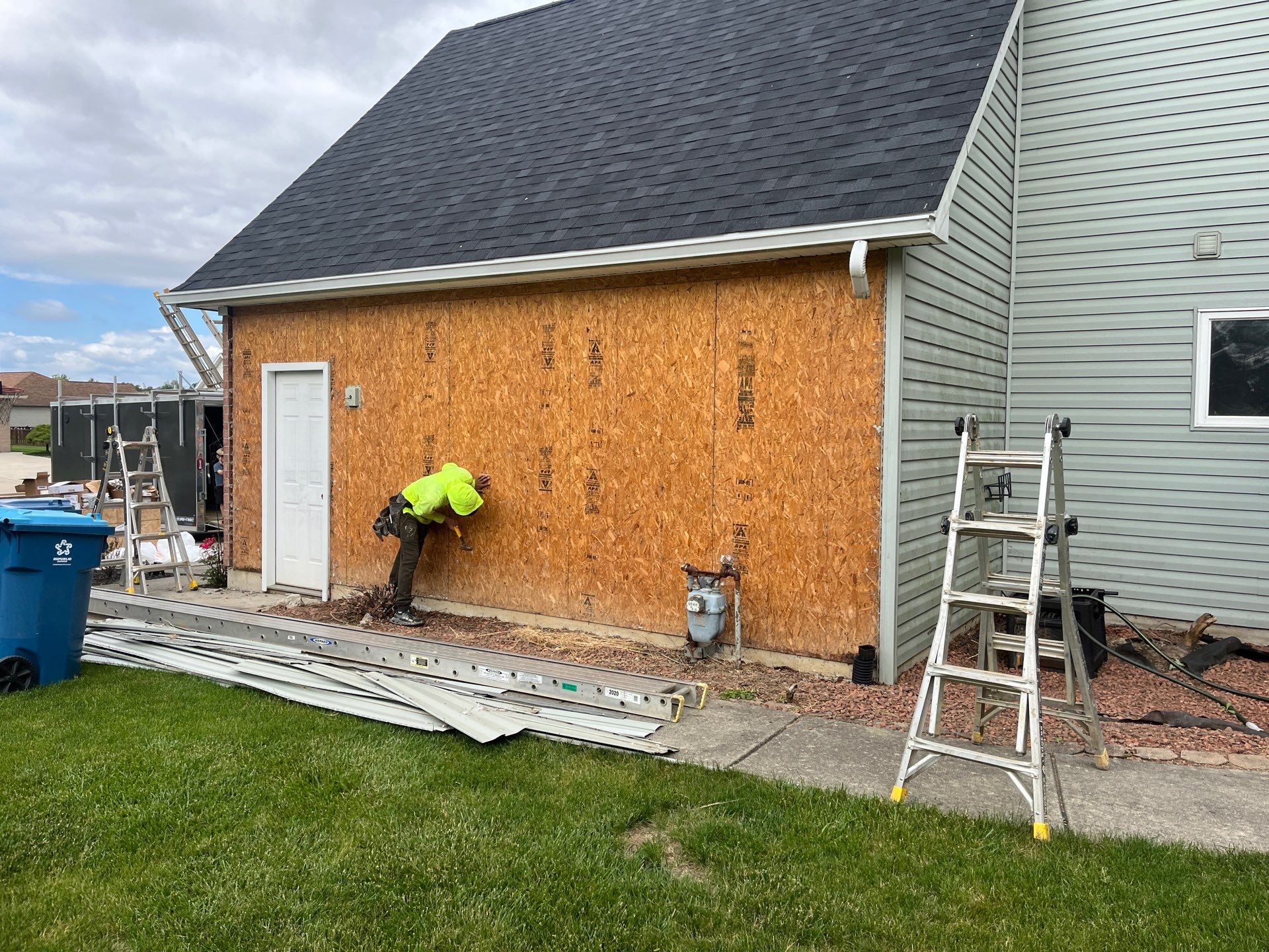 Exterior Installation using Onyx Black Durations and White Siding by WIW Enterprises Inc