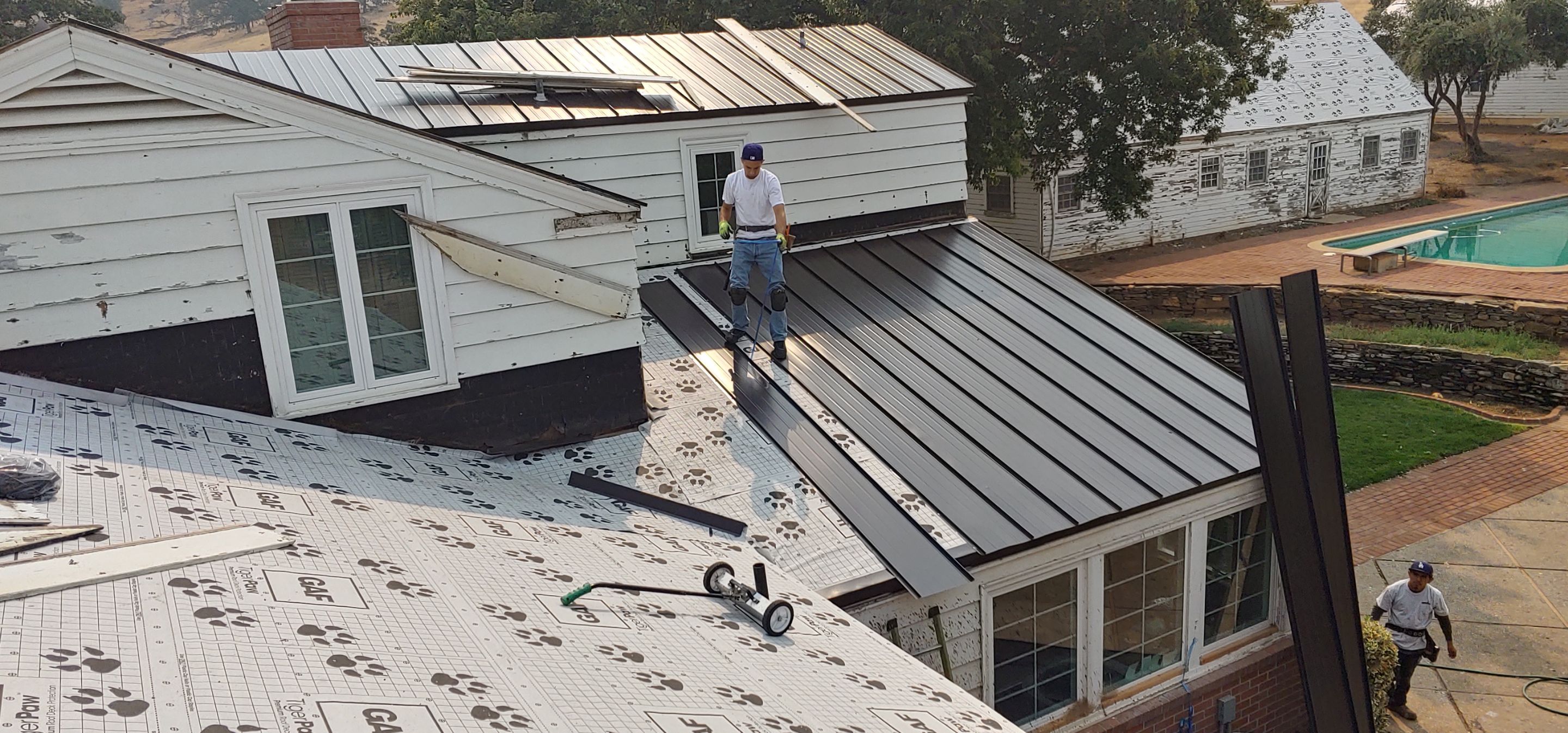 Residential Roofing Installation using Standing seam metal roofing system by Straight Edge Roofing Inc