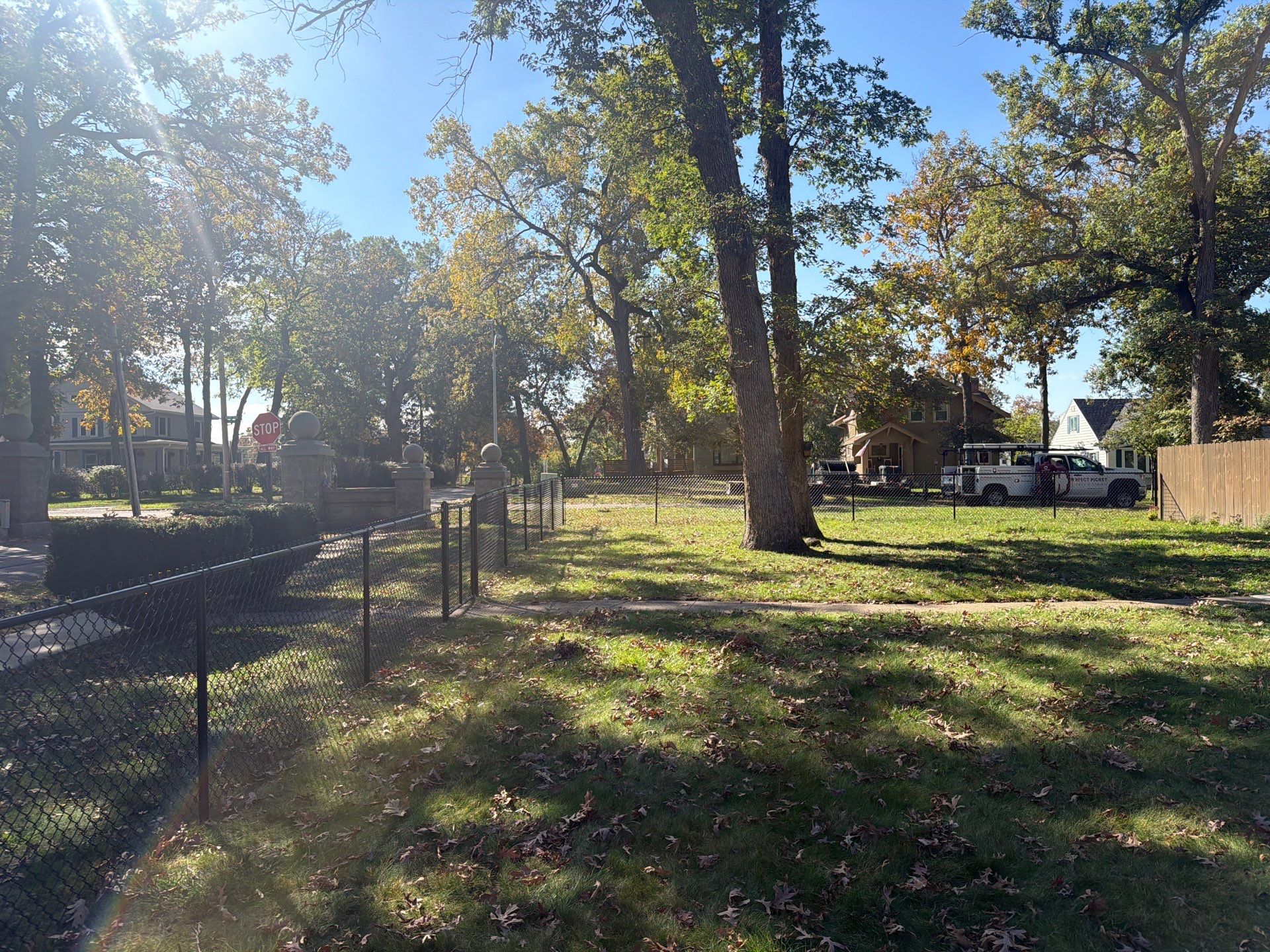 Residential Black Chain Link Fencing in Cedar Falls by Perfect Picket Fence and Stain