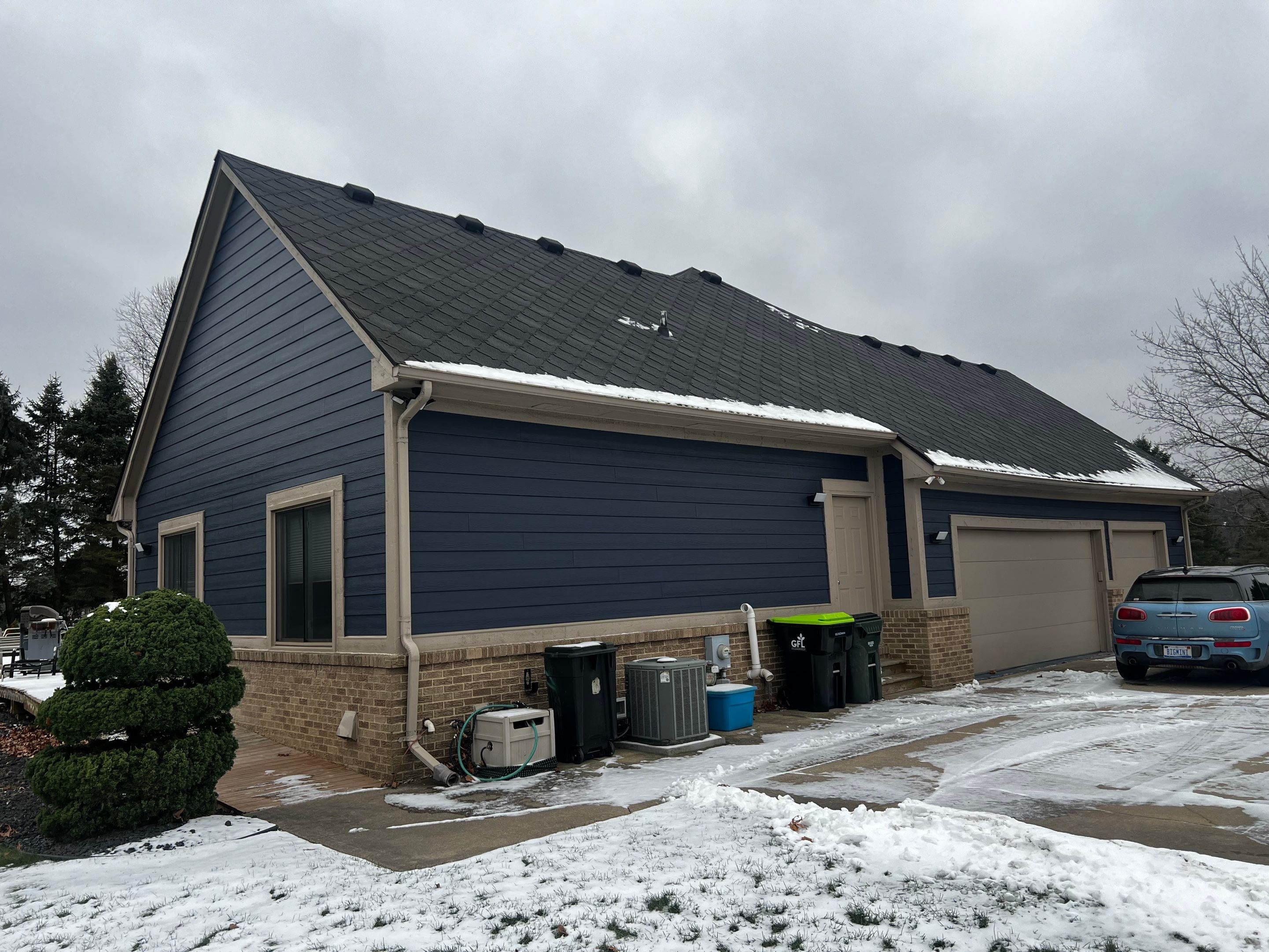 Siding Replacement using James HardiePlank Cedarmill in Deep Ocean color by Bloomfield Construction & Restoration