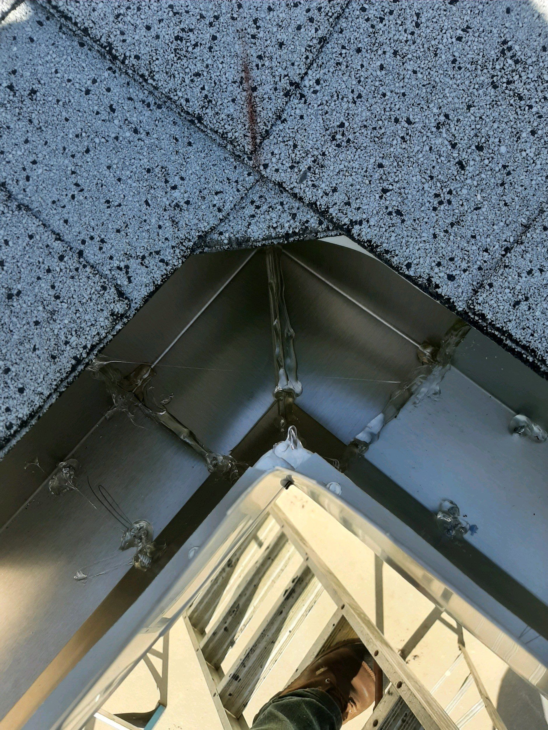 Seamless Gutter Installation using White by Gutter Professors