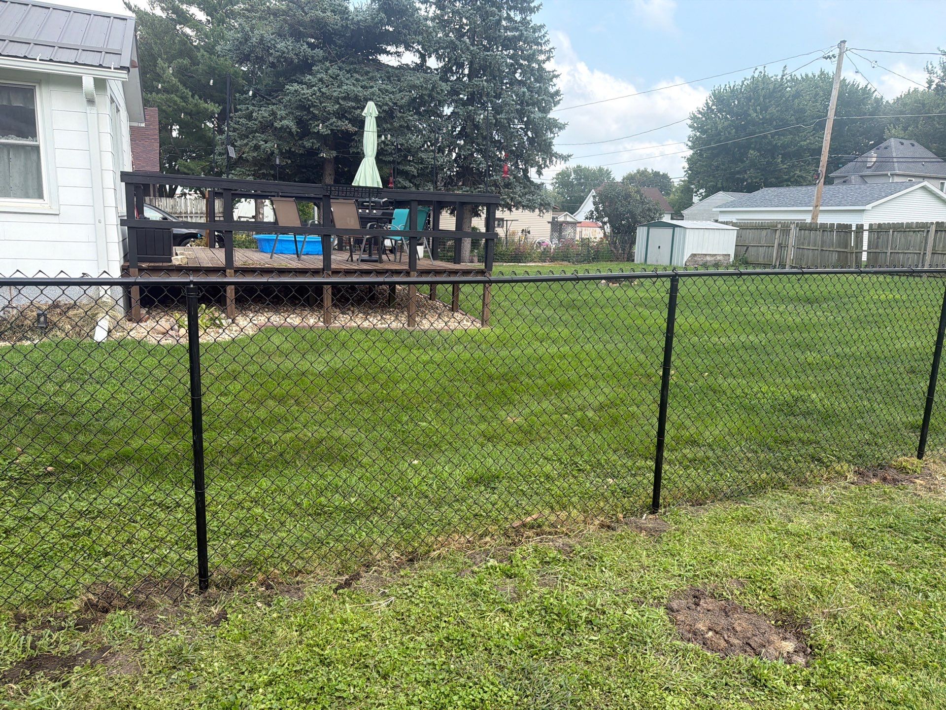 Residential Black Chain Link Fence Installation in Reinbeck by Perfect Picket Fence and Stain