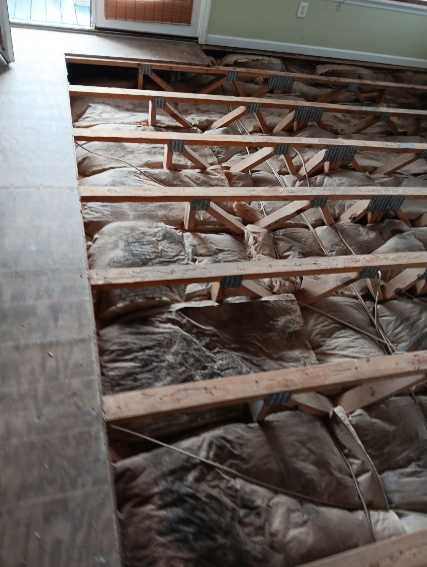 Caving Floor Flooring Repair in Oak Island, NC by RGR Construction and Roofing, LLC