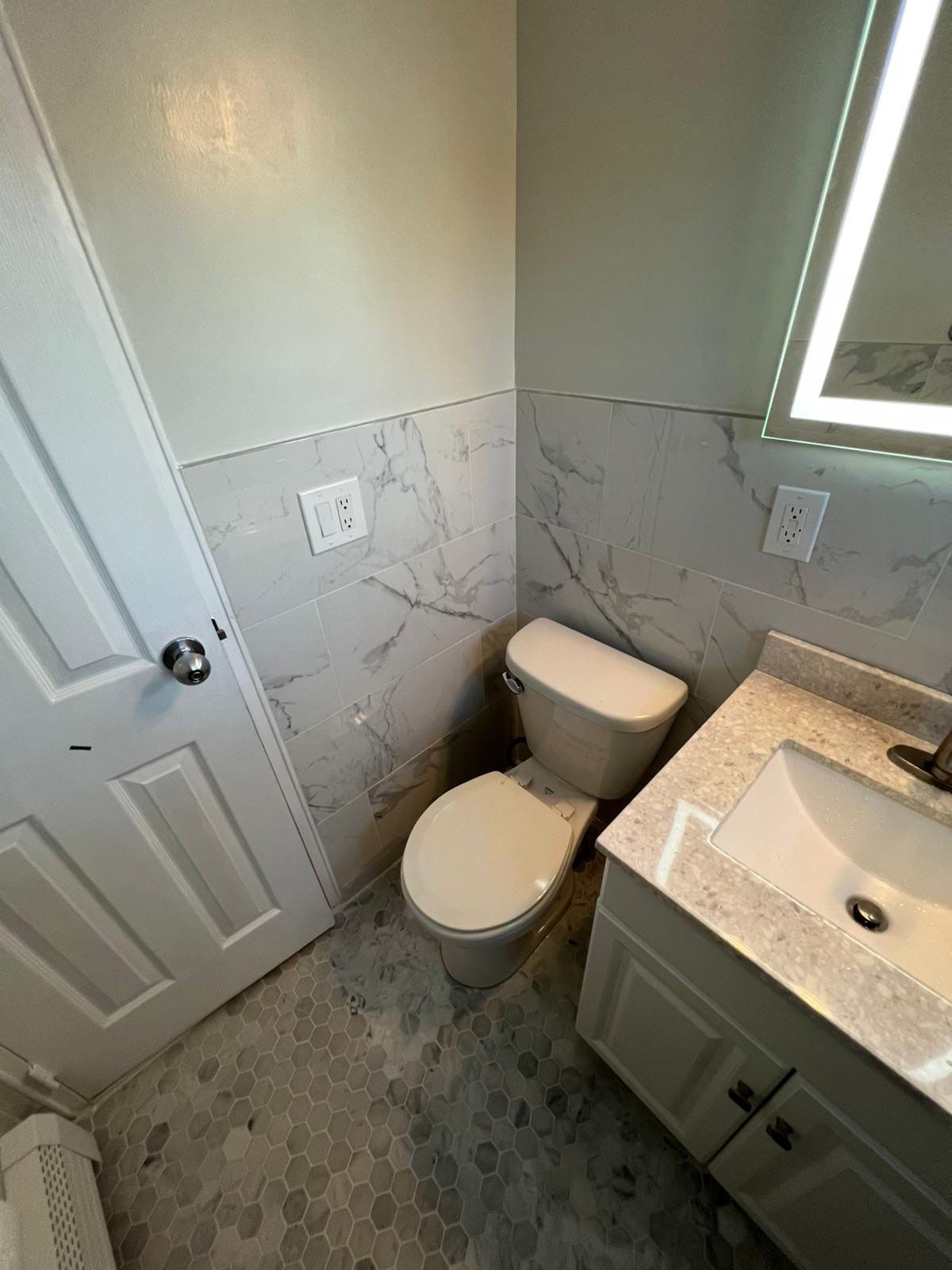 Bathroom Remodel using Tile by Home Concepts Construction