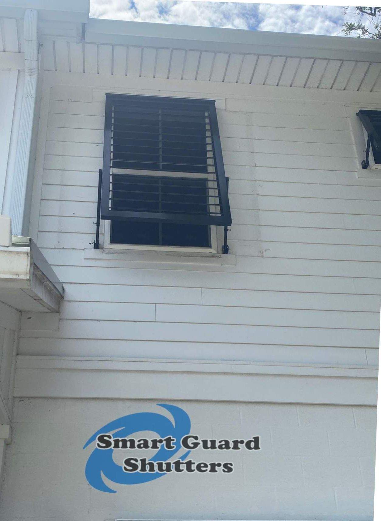 Impact Bahama Shutters in Jet Black by Smart Guard Shutters