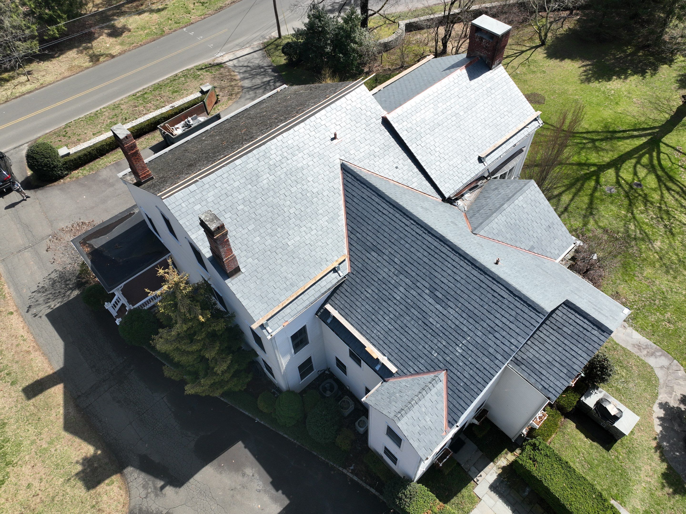 Residential Roofing Installation using Vermont Slate by A Plus Exterior