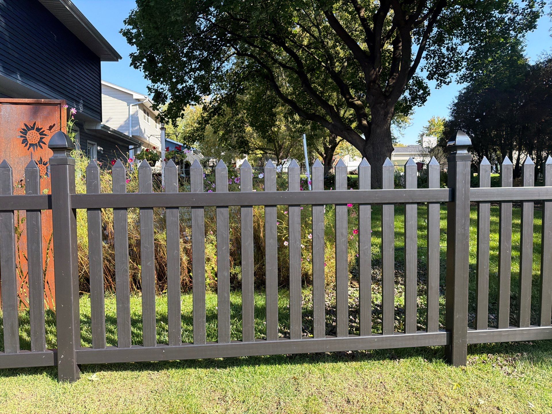 Black Vinyl Spaced Picket Fence Installation in Cedar Falls by Perfect Picket Fence and Stain