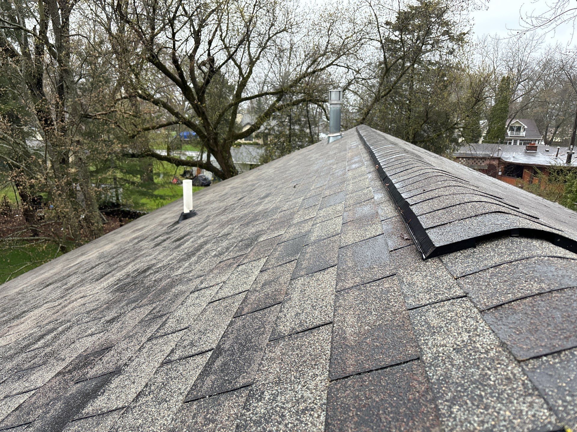 Installing new Roof and Gutter Protection after Hail Damage by Acme Exteriors