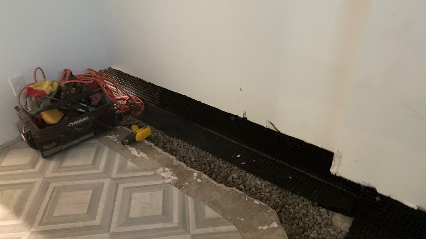 Interior Drain Tile & Buried Discharge in St. Anthony, MN by Waterproofing Northeast