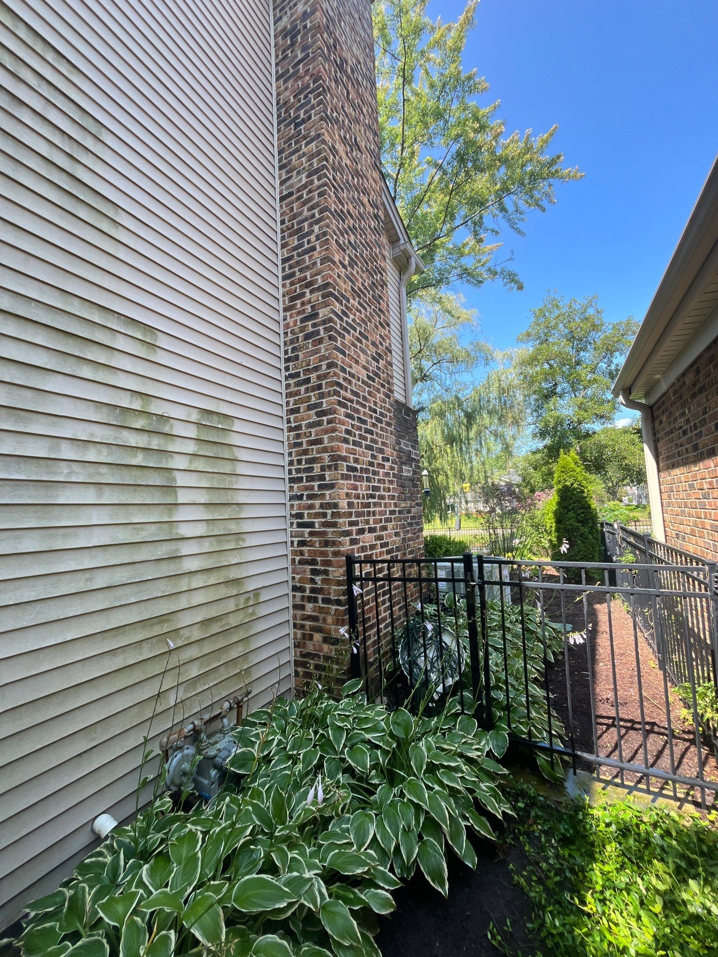 Housewashing  using Algaecide, soft wash soap by Northern Power Washing LLC.