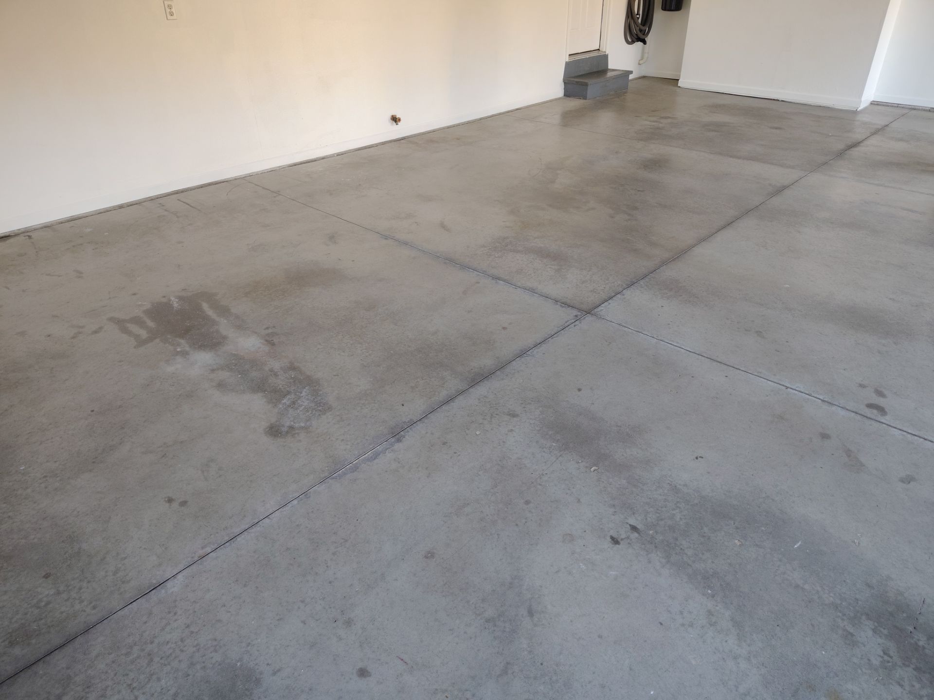 New Johnston Garage Resurfacing by Revival Concrete Coatings, LLC