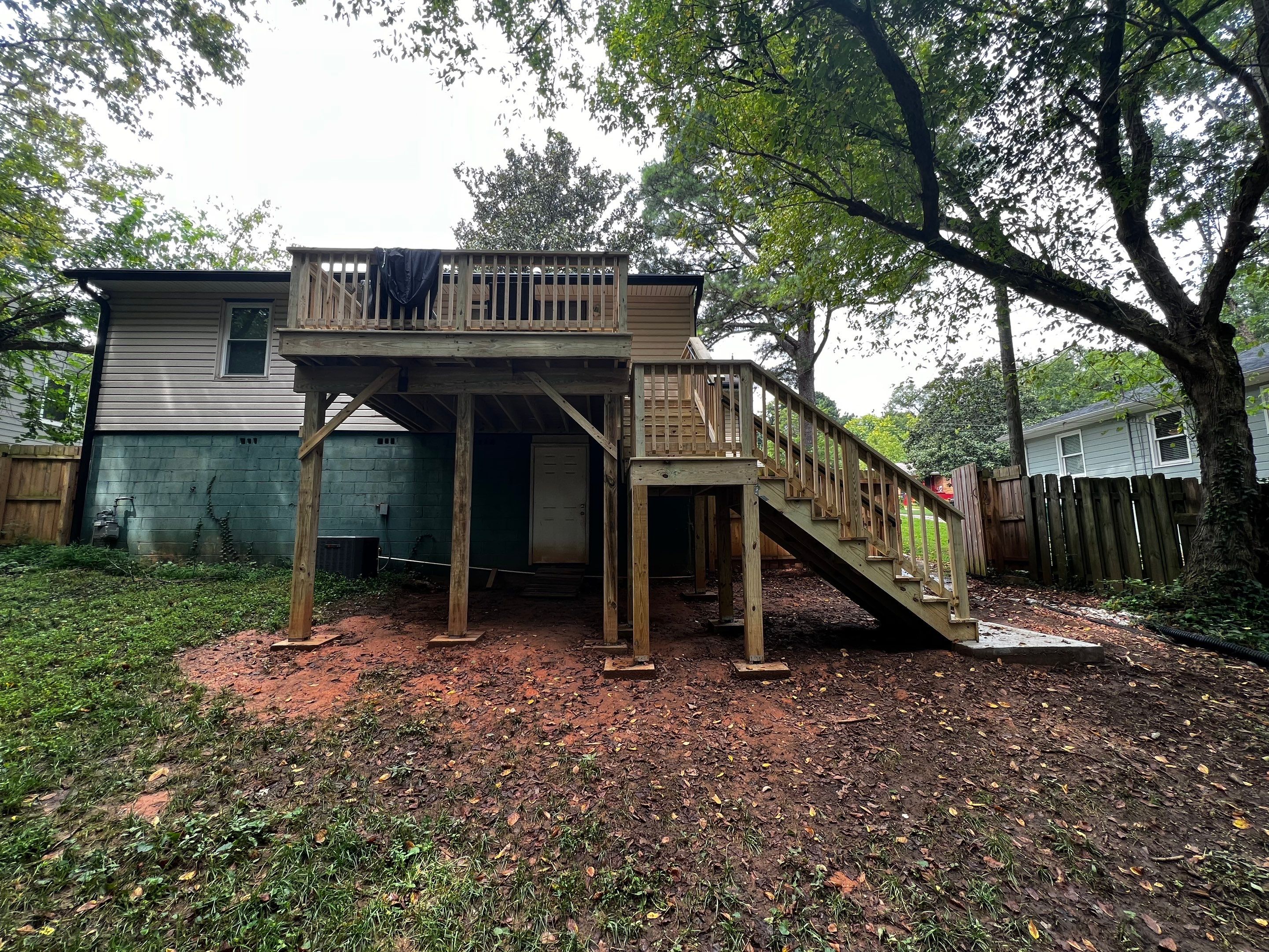 Elevated Pressure-Treated Wood Deck and Staircase Replacement in Atlanta by Swift Home Renovations