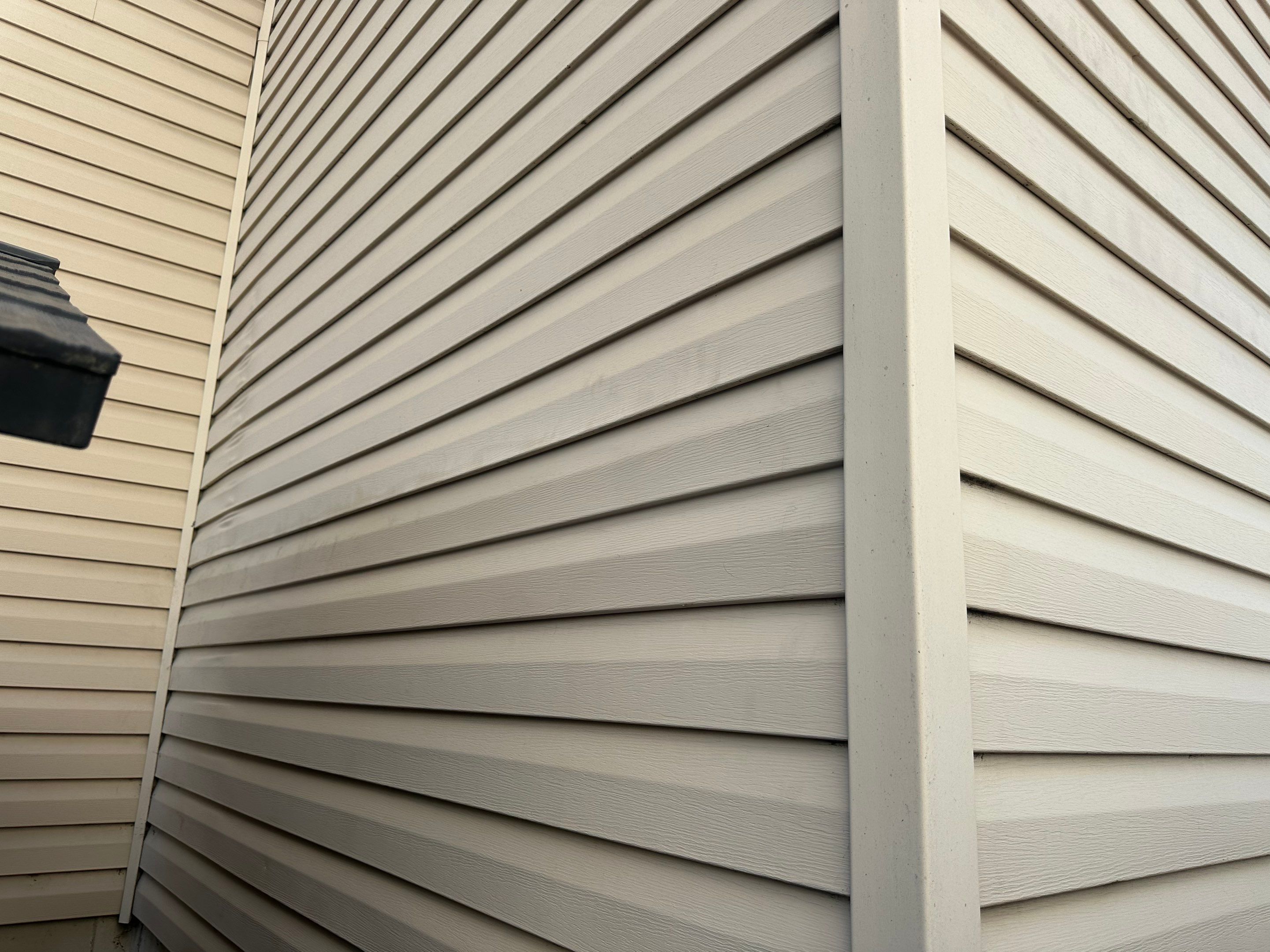Mocha Lap Siding Installation for St. Louis Residential Exterior by Acute Roofing And Exteriors
