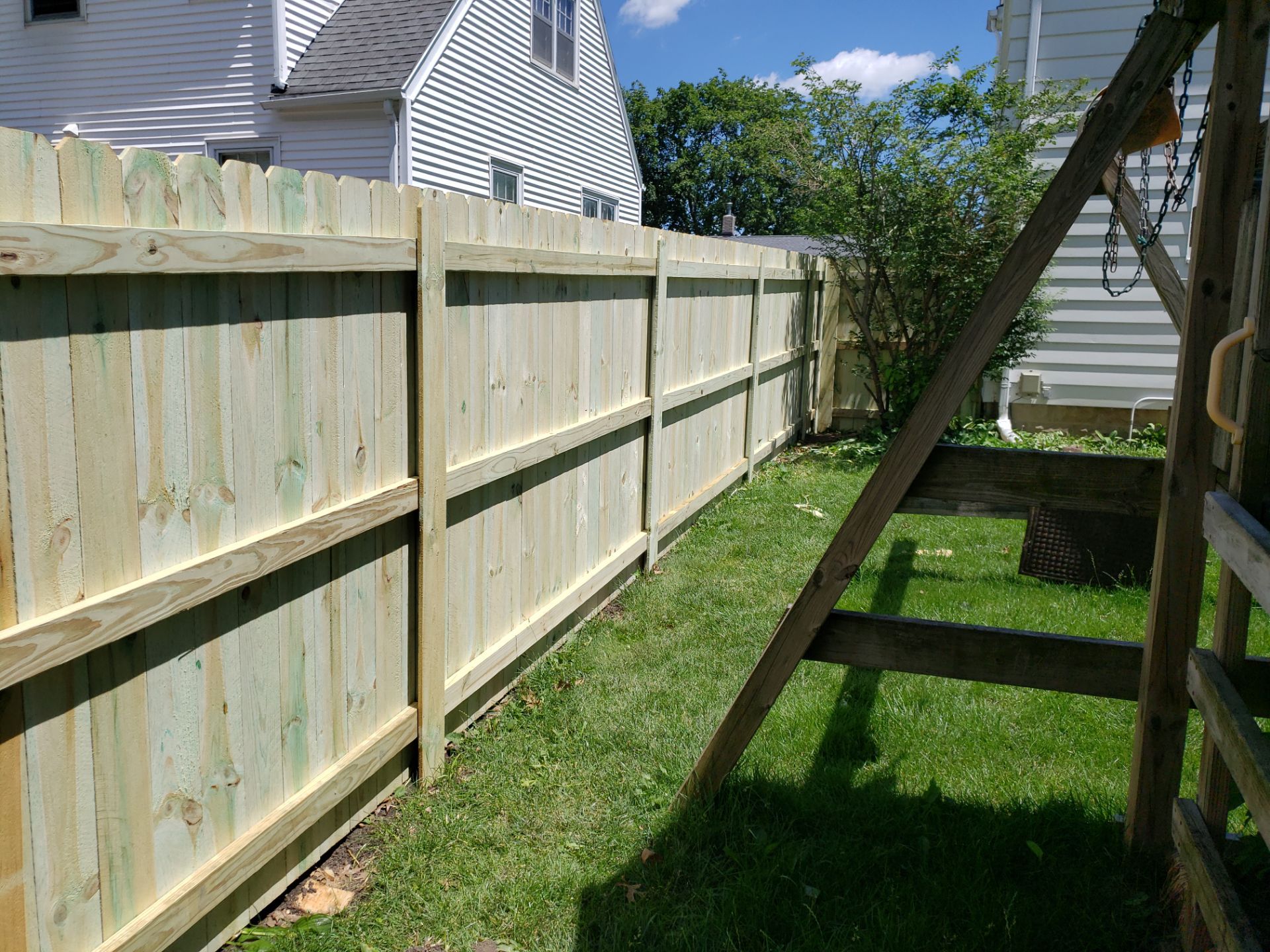 Pressure-Treated Pine Privacy Fence Replacement in Waterloo, Iowa by Perfect Picket Fence and Stain