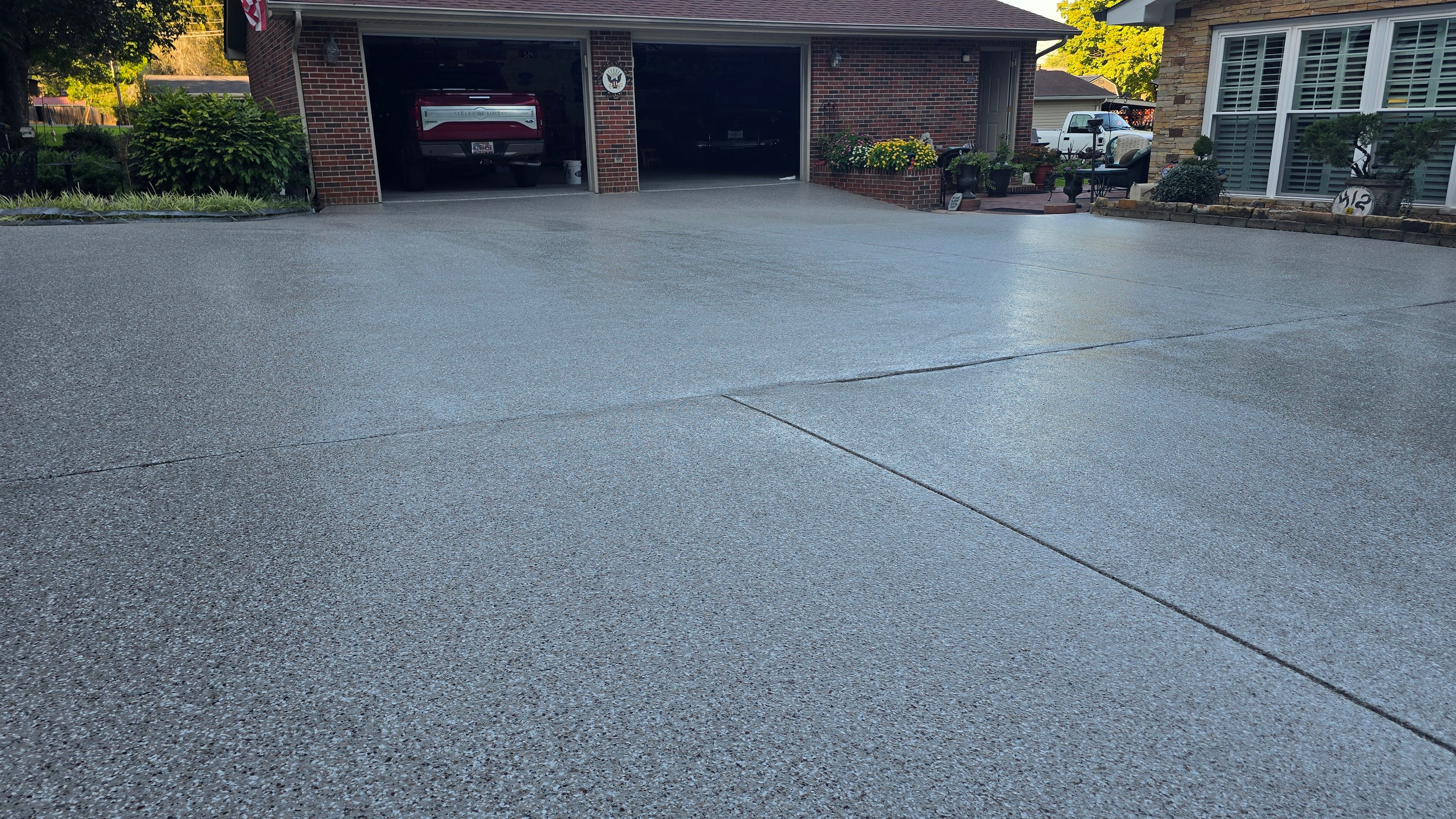 Driveway, Garage, Porch, and Sidewalk using Creekbed by Elite Floor Solutions