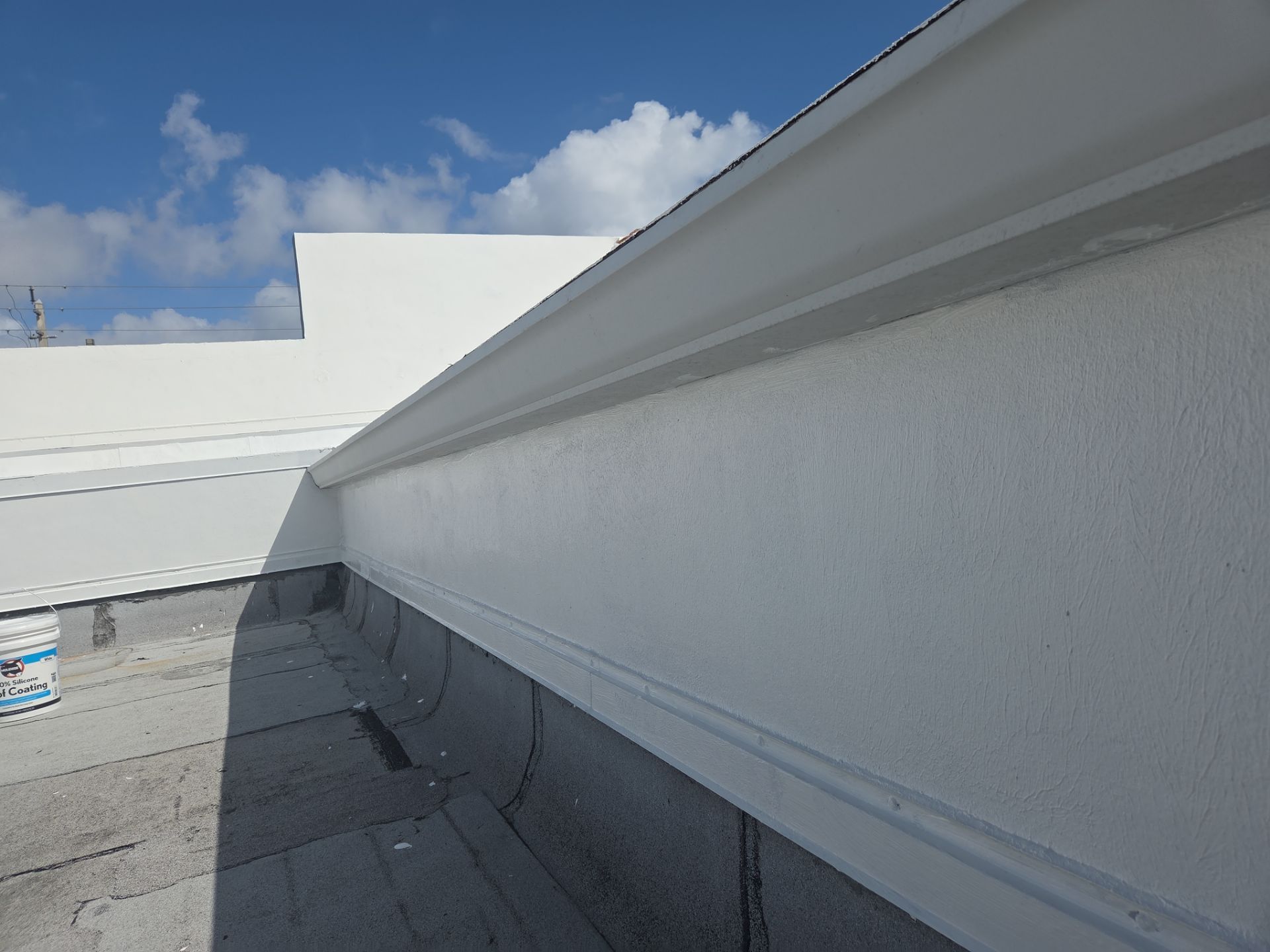 Commercial Flat Roof Restoration Using Silicone Coating in Hallandale Beach by Aastro Roofing