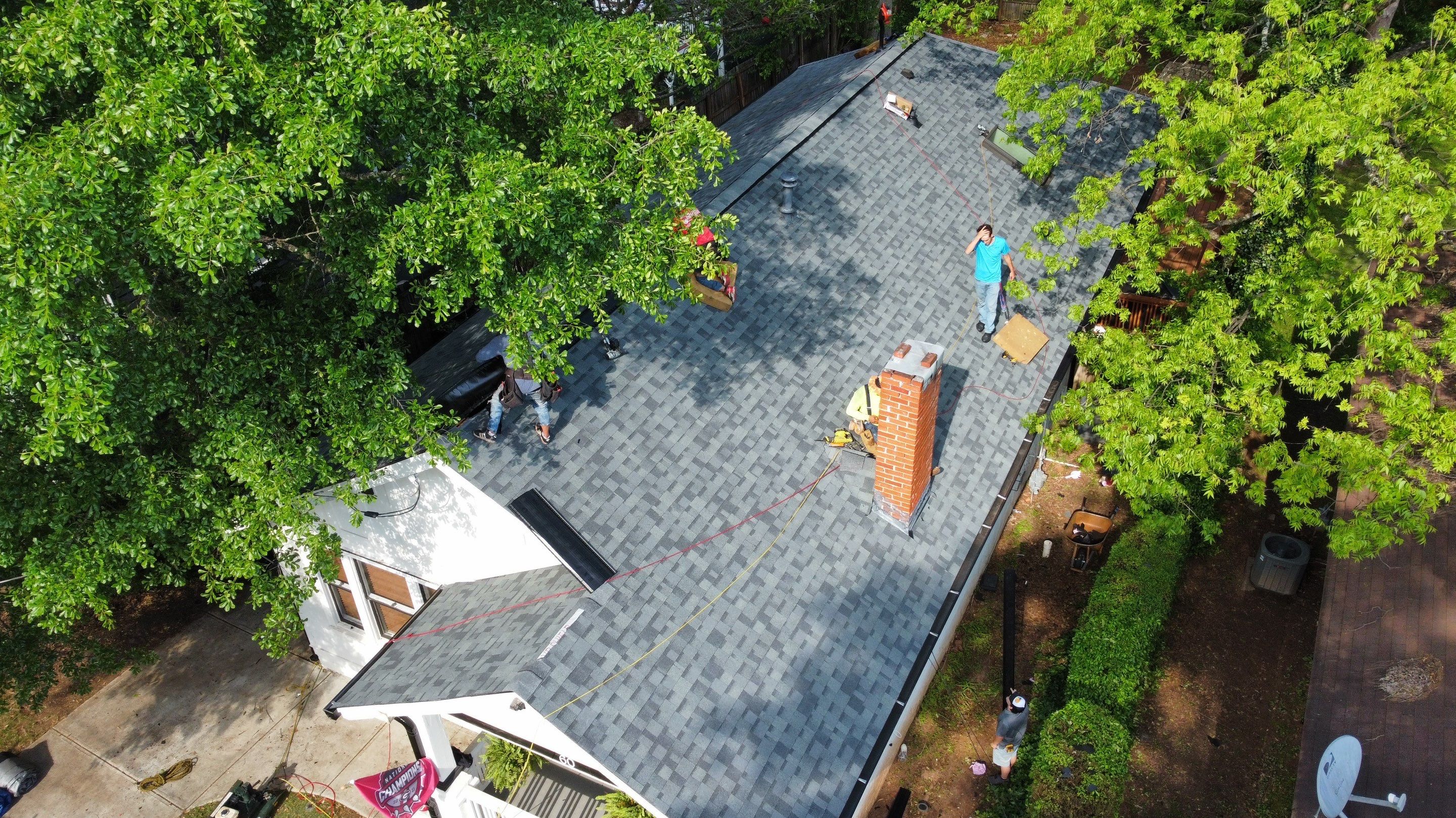 roof replacement and new black gutters by Nailed It Roofing & Remodeling LLC